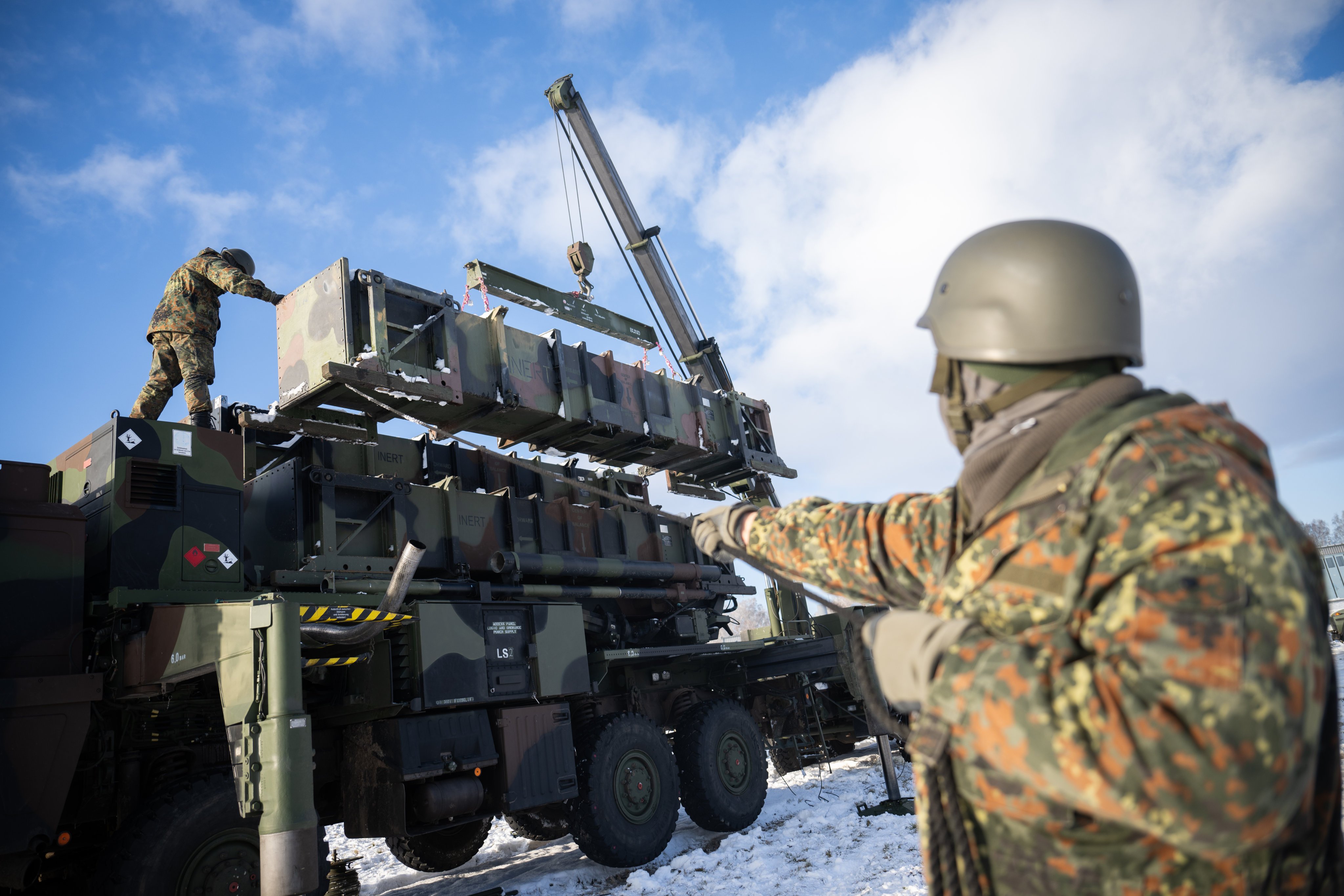 Ukrainian soldiers reload containers for a launcher during a training course on the Patriot air defence system at a German base. Photo: dpa