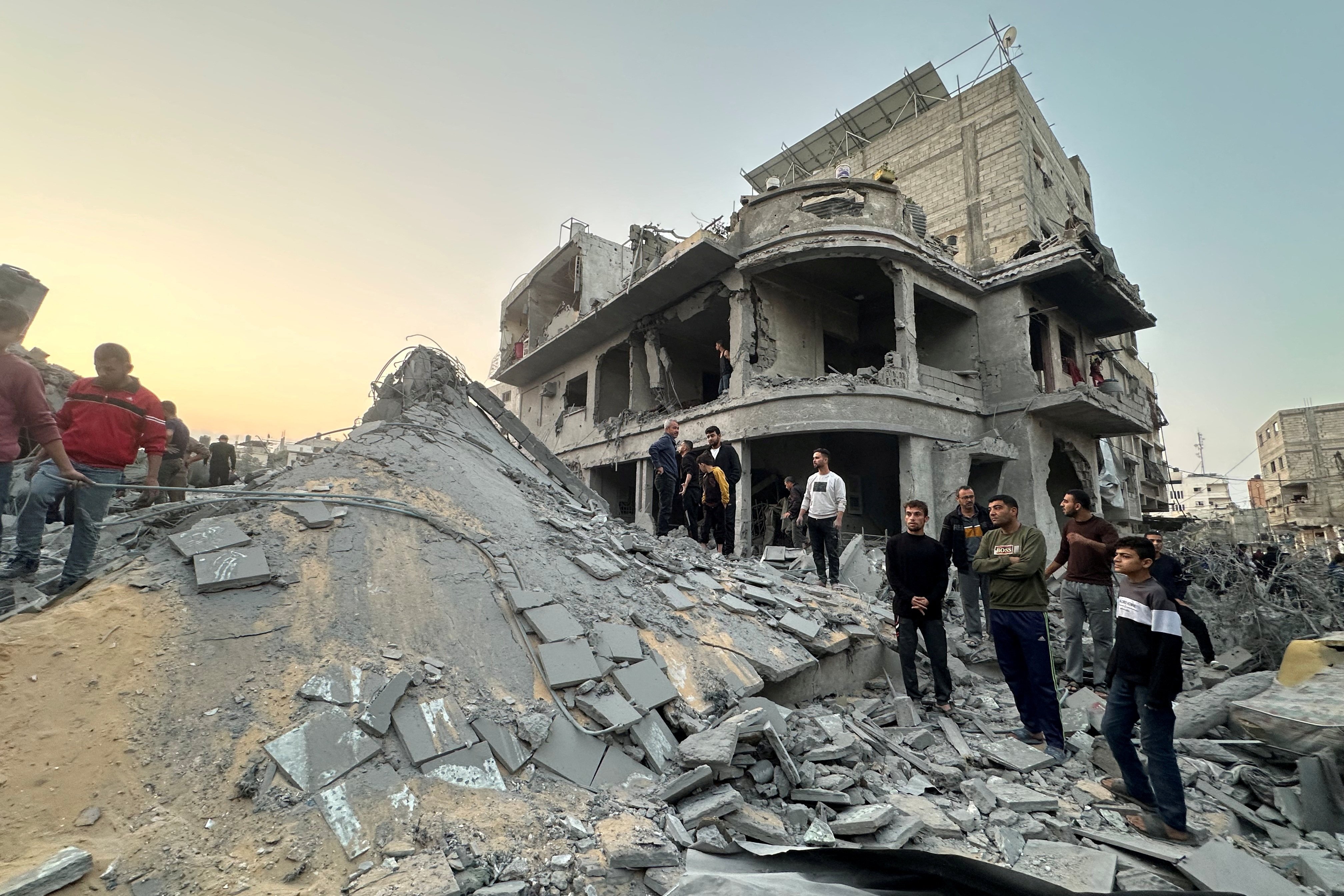 Palestinians gather at the site of an Israeli strike on a house, in Jabilia in the northern Gaza Strip on Sunday. Photo: Reuters