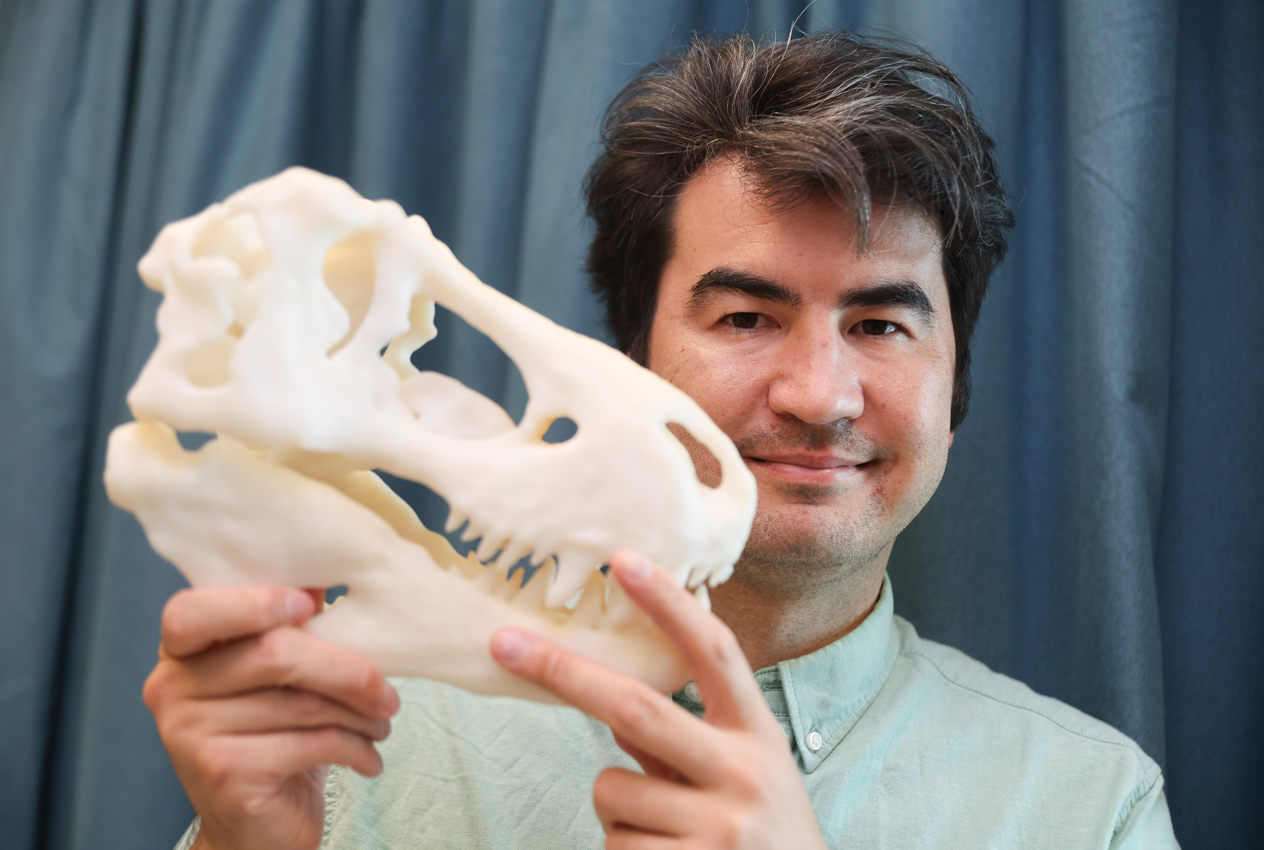 Michael Pittman, life science assistant professor at the Chinese University of Hong Kong, shows a 3D-printed dinosaur bone model. Photo: Edmond So