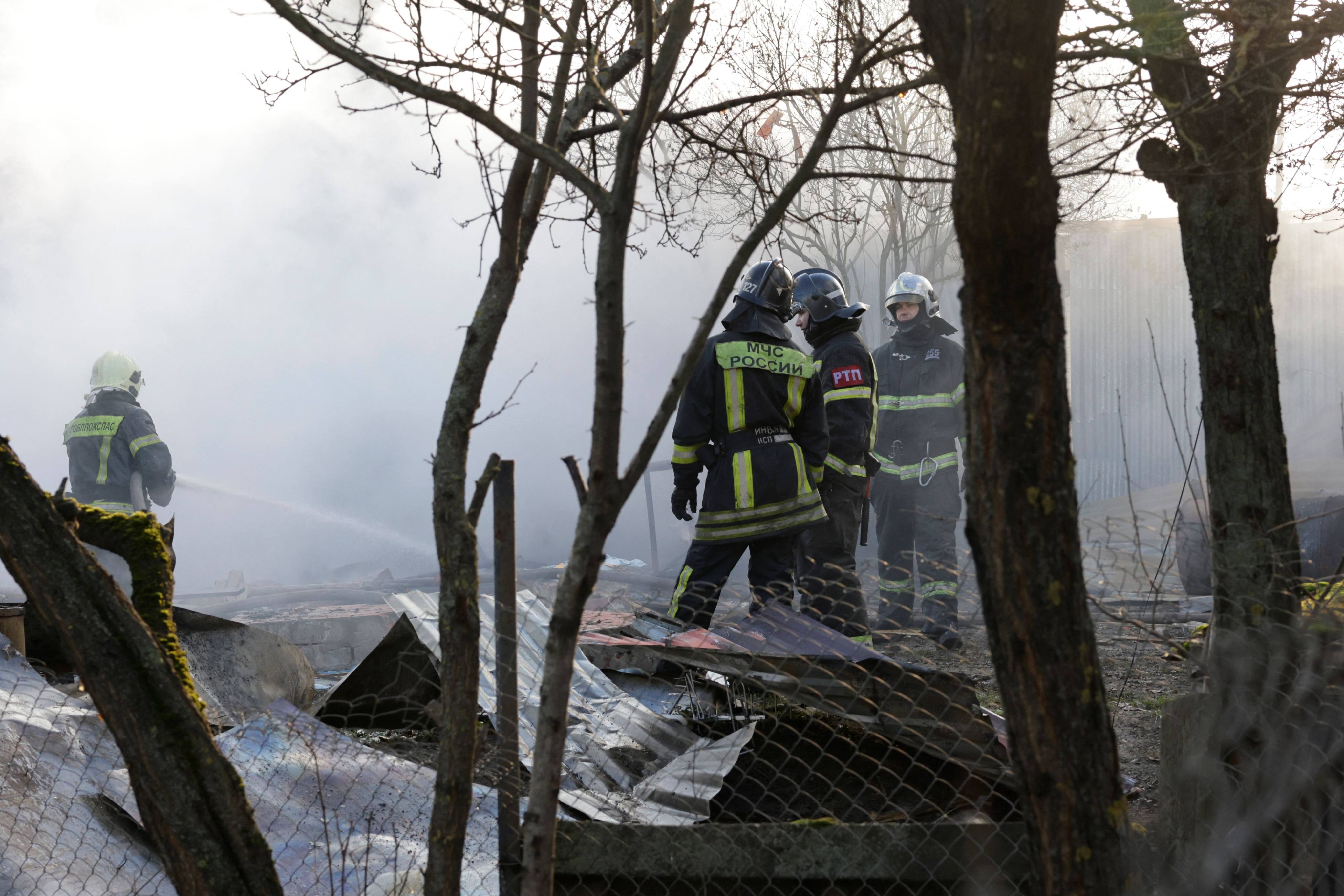 Rescuers at the site of a drone attack in the village of Stanovoye, Moscow region, on Sunday. Photo: AFP