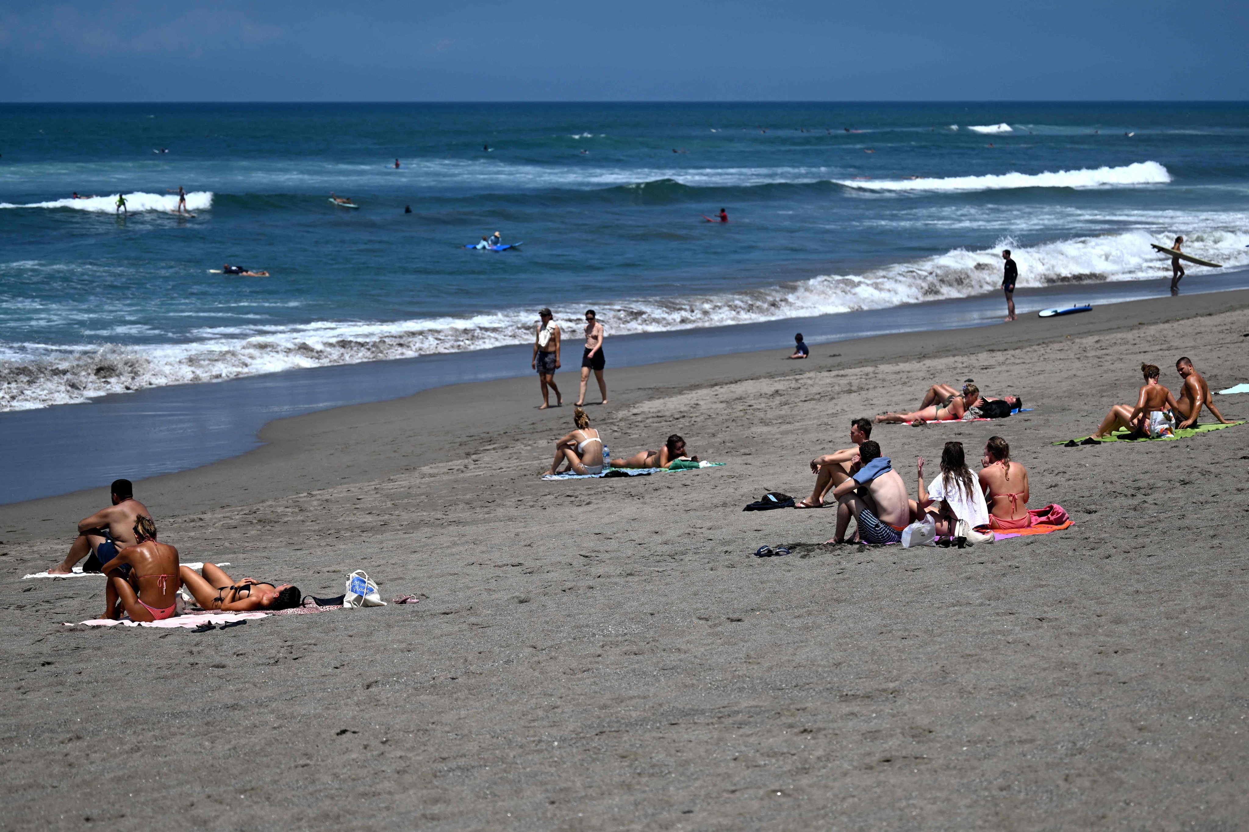 On Indonesia’s beach-fringed resort island of Bali, fed-up locals want to slow the mass tourism that is their biggest money earner -- hoping a plan to freeze hotel-building can restore some calm. File photo: AFP