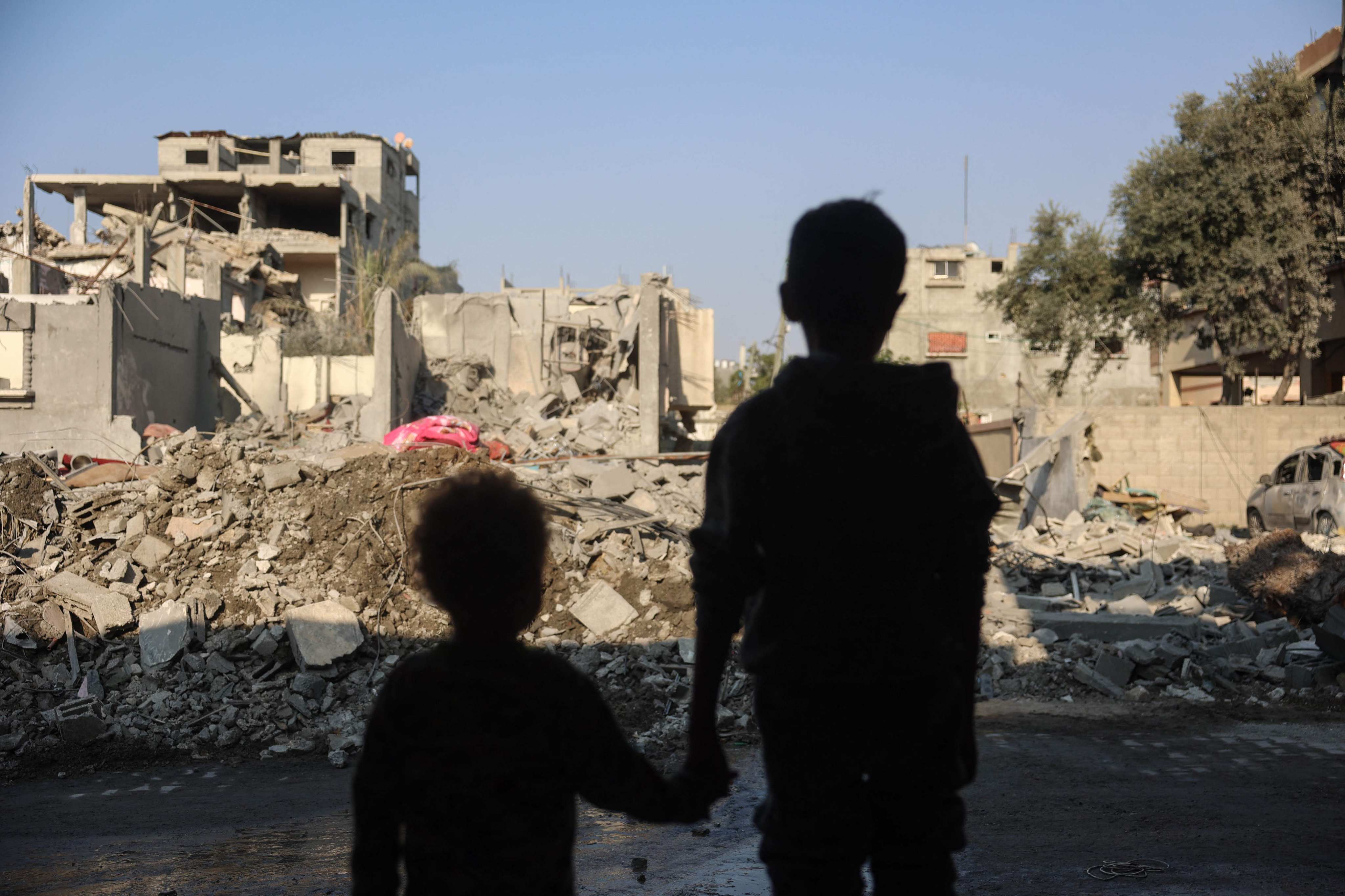 Children stare at the destruction after an Israeli strike in the Nuseirat refugee camp in the central Gaza Strip on Thursday. Photo: AFP