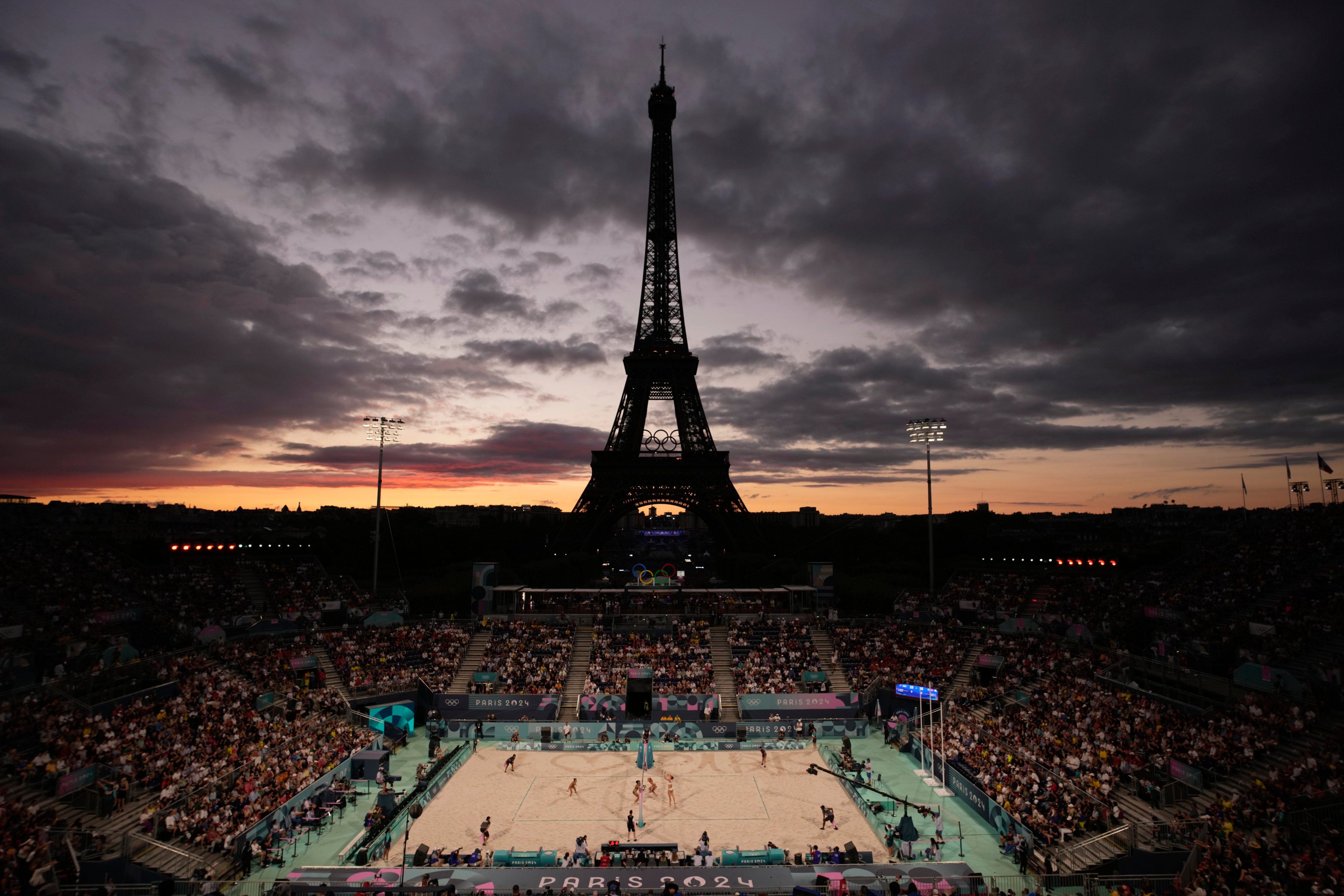 The Eiffel Tower looms in the background during women’s beach volleyball at the 2024 Summer Olympics. Photo: AP