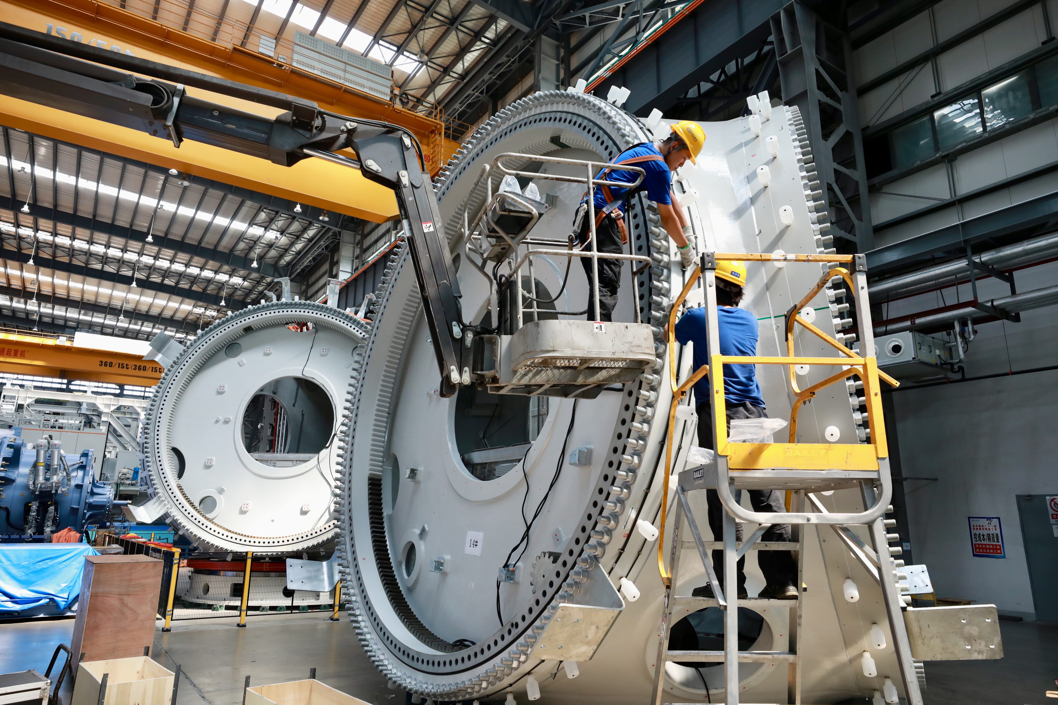 Workers produce offshore wind turbines in Fuqing in China’s Fujian province, on August 8. Photo: Xinhua