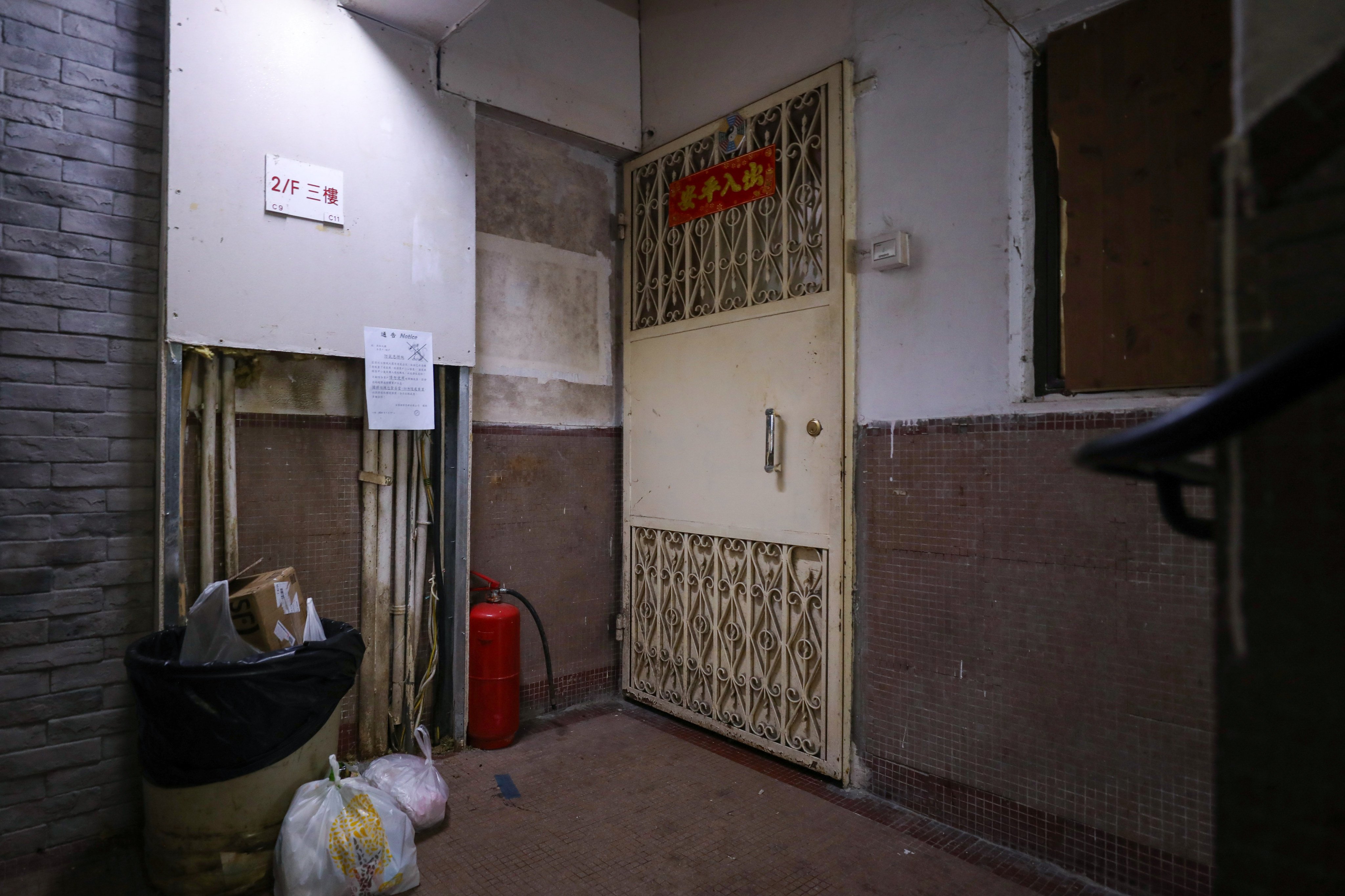 The door to the flat in Tuen Mun, where the couple’s two dead babies were found in glass jars by a cleaner in March. Photo: Xiaomei Chen