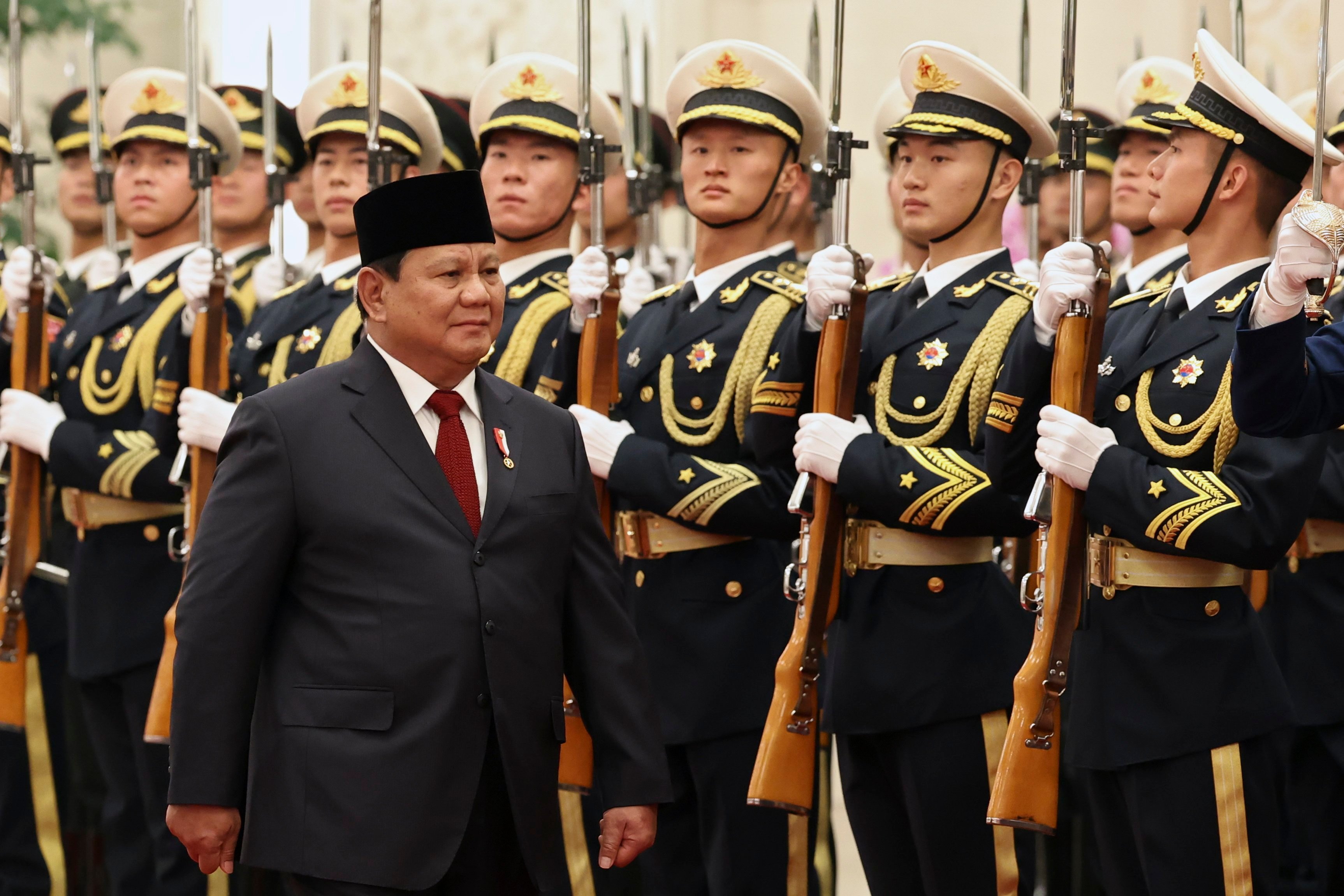 Indonesian President Prabowo Subianto reviews the honour guard during a welcome ceremony in Beijing on November 9. Photo: EPA-EFE