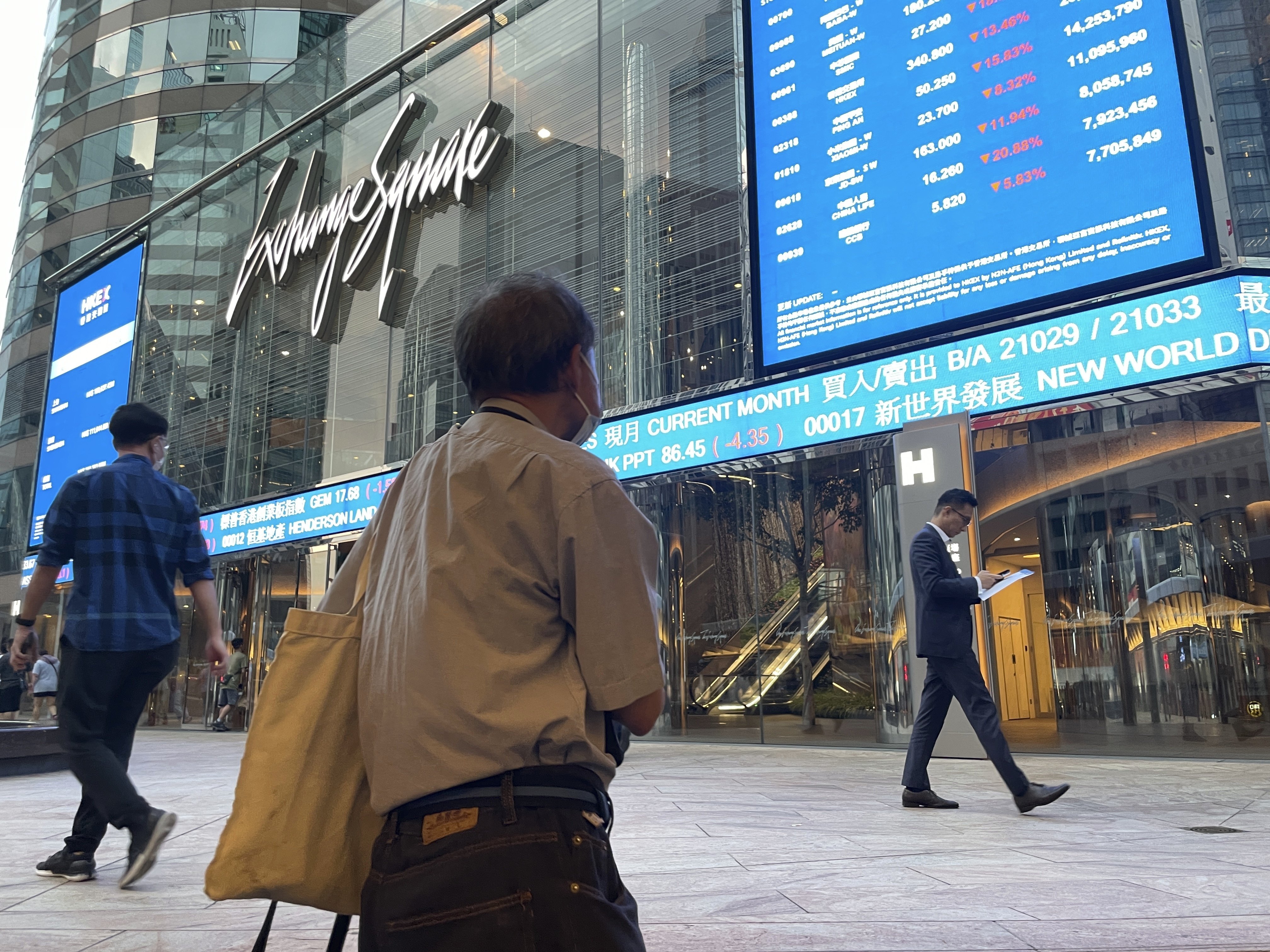 People walk past Exchange Square, home of Hong Kong’s bourse operator, on October 8, 2024. Photo: AP