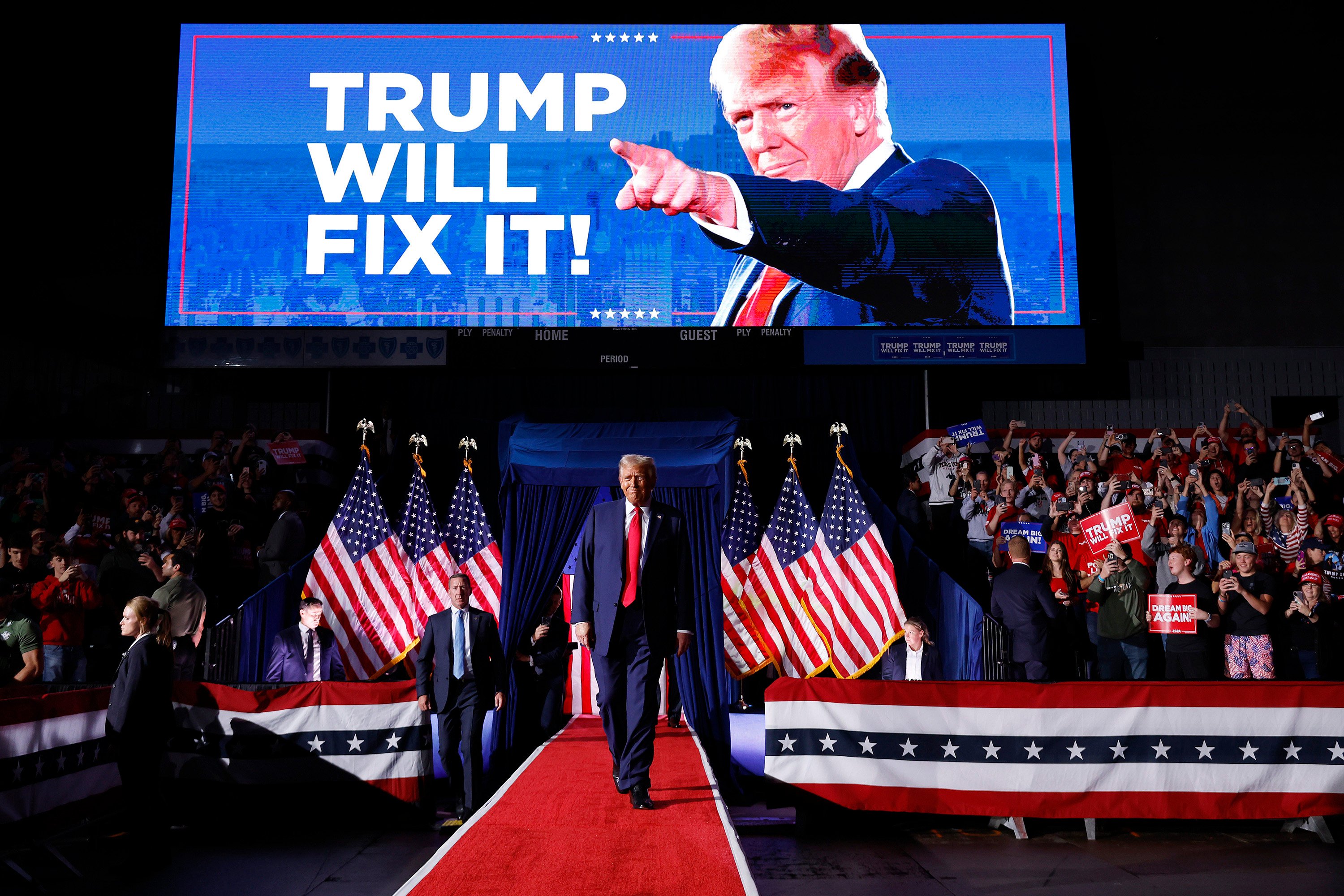 Donald Trump takes to the stage for his last rally before the presidential election, in Van Andel Arena on November 5, in Grand Rapids, Michigan. Photo: Getty Images/TNS