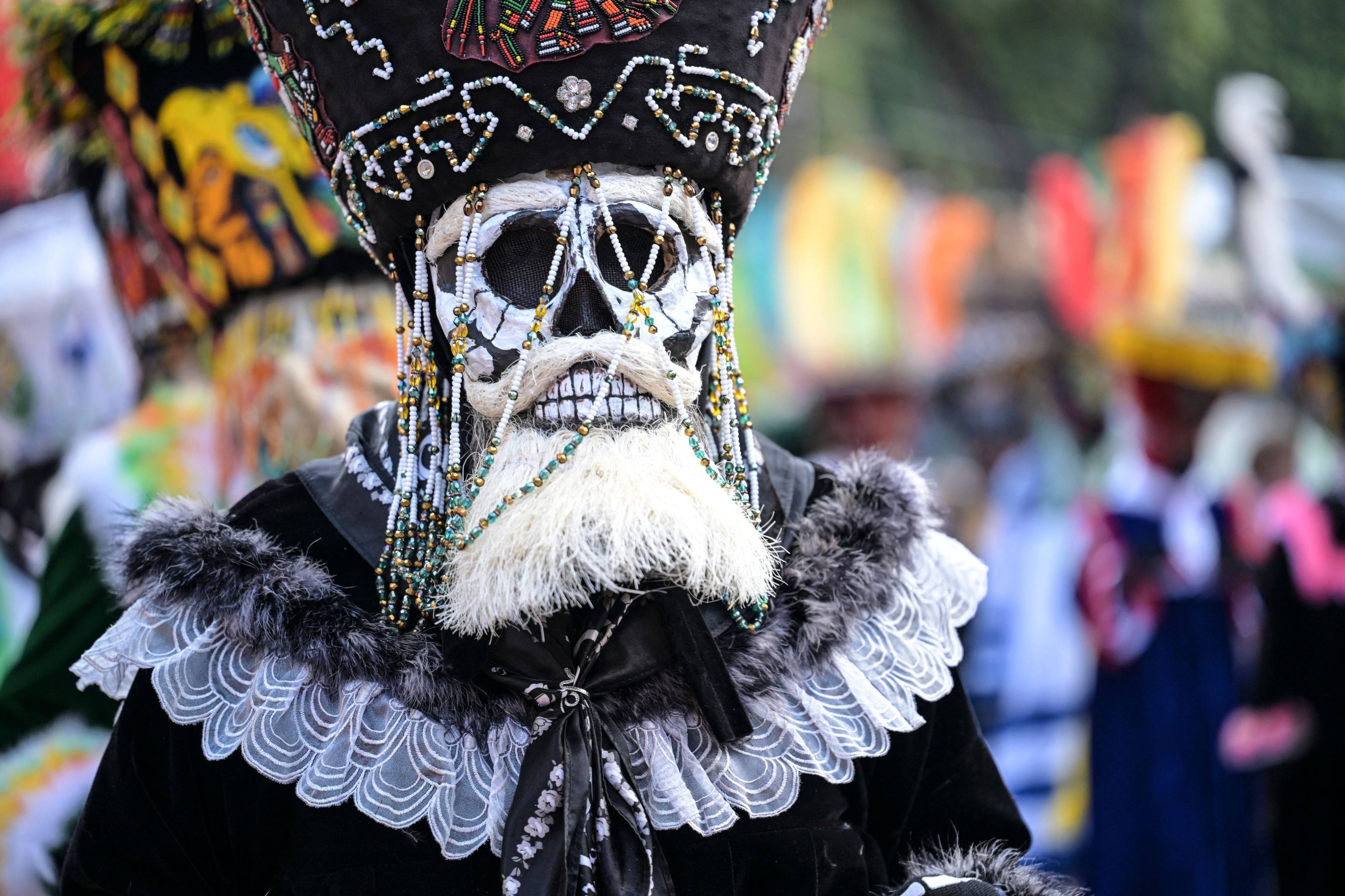 Traditional costumed dancers participate in a procession called “Ninopan” in Mexico. Photo: AFP