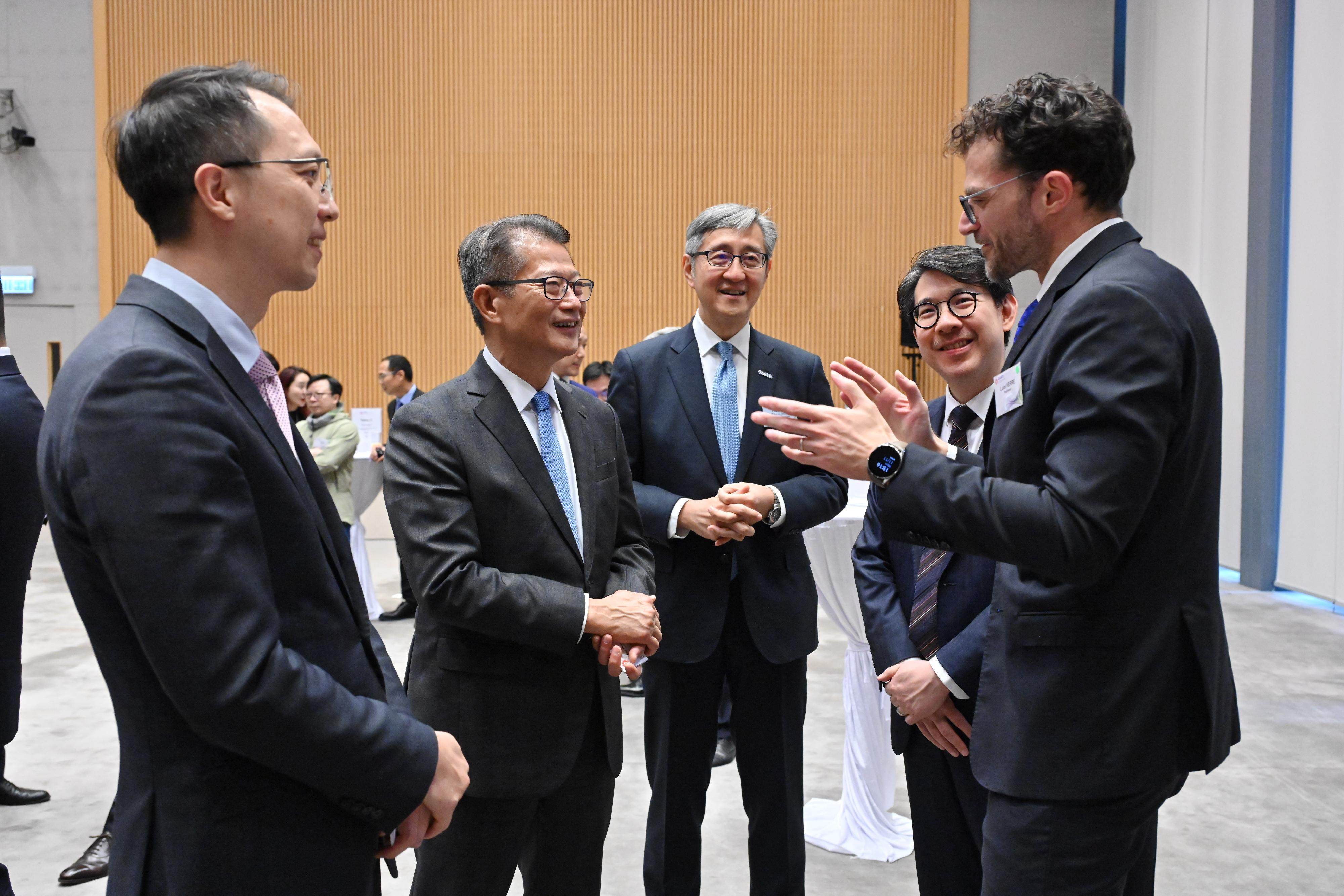 Financial Secretary Paul Chan (second from the left) attends the signing ceremony. Photo: Handout