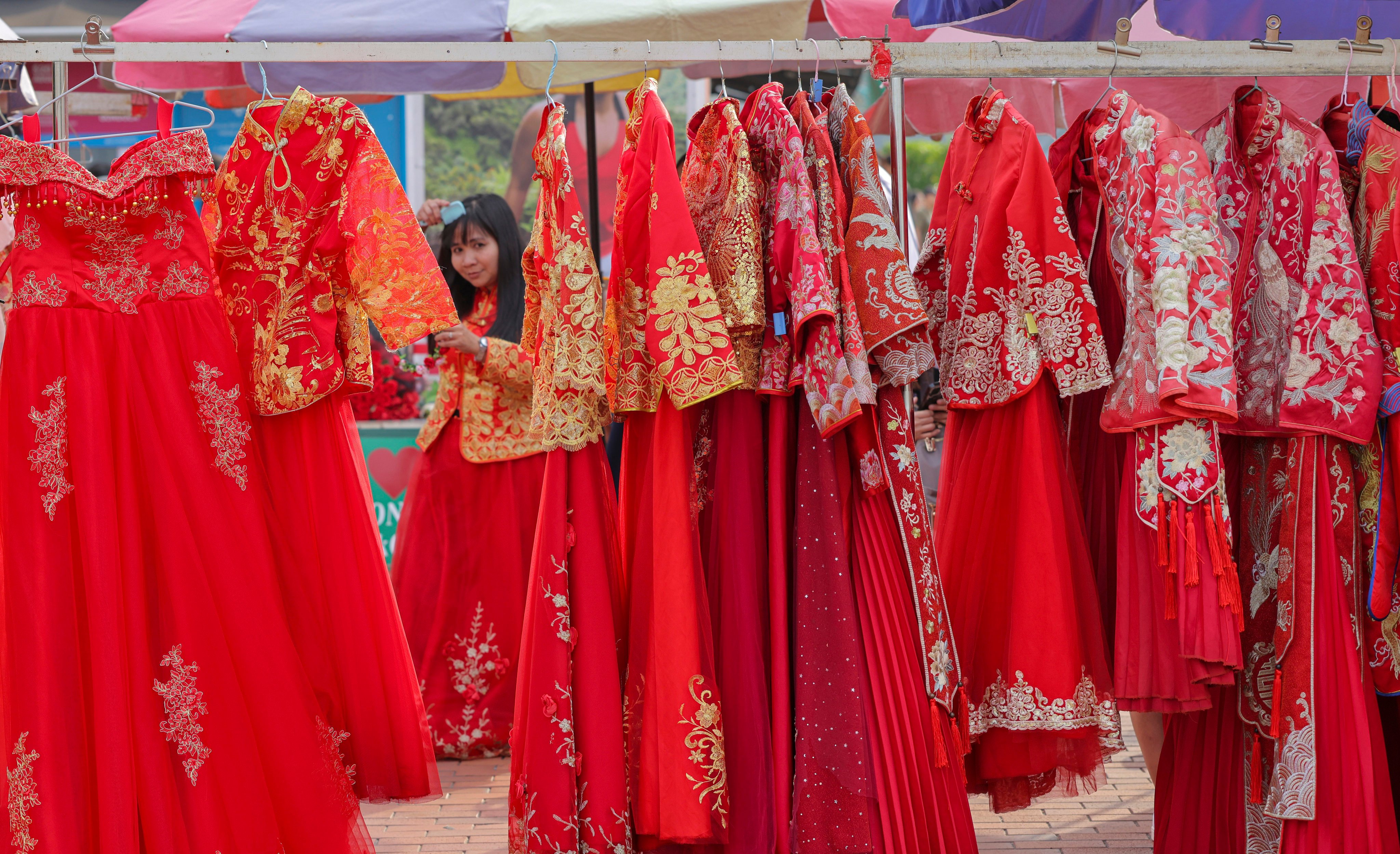 Qun kwa, a type of wedding dress worn in Hong Kong and other parts of southern China, comes in different grades based on how much of the red base fabric is covered with gold and silver embroidery. Photo: Jelly Tse