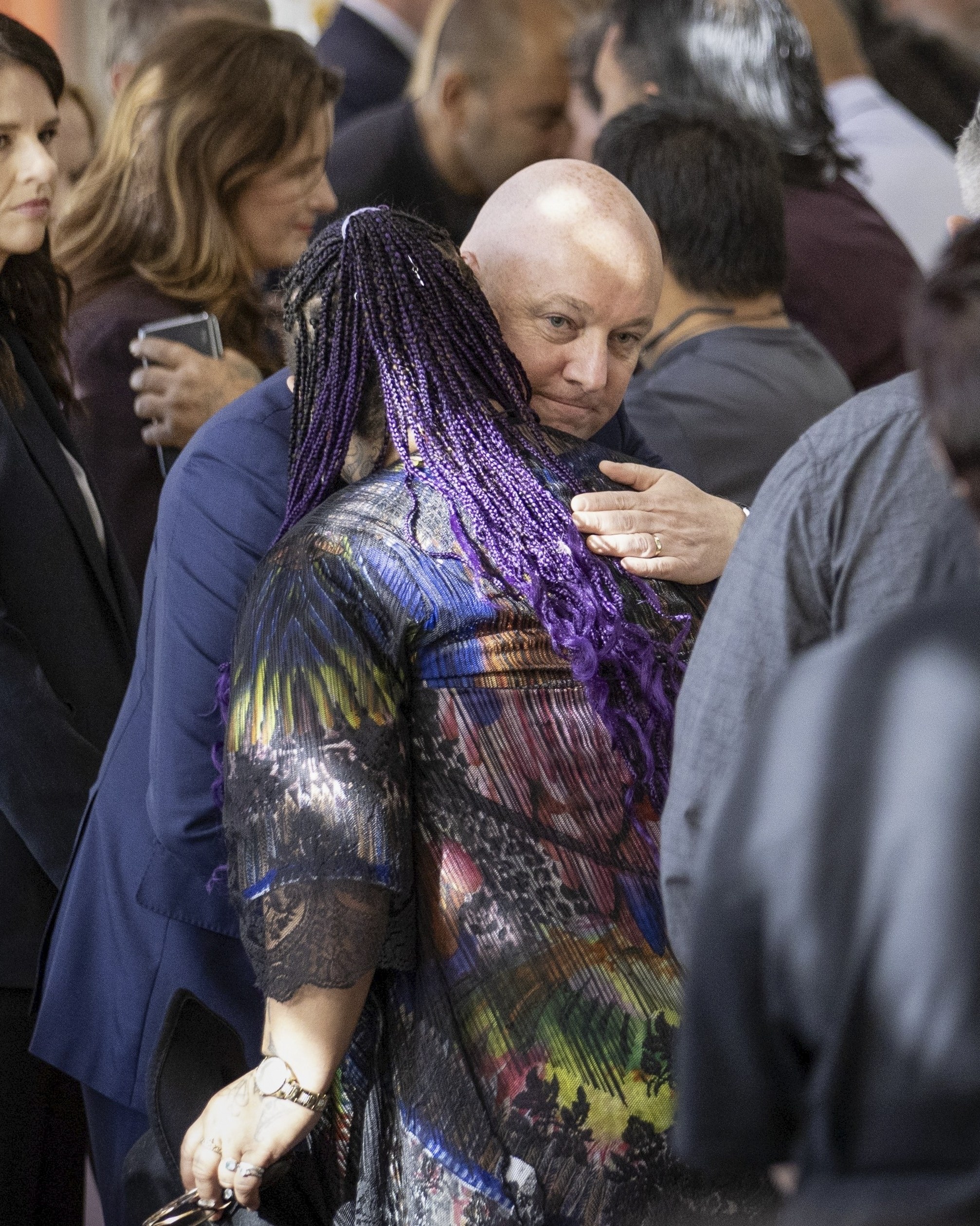 New Zealand’s Prime Minister Christopher Luxon embraces an abuse survivor following his “formal and unreserved” apology in parliament on Tuesday. Photo: Stuff via AP