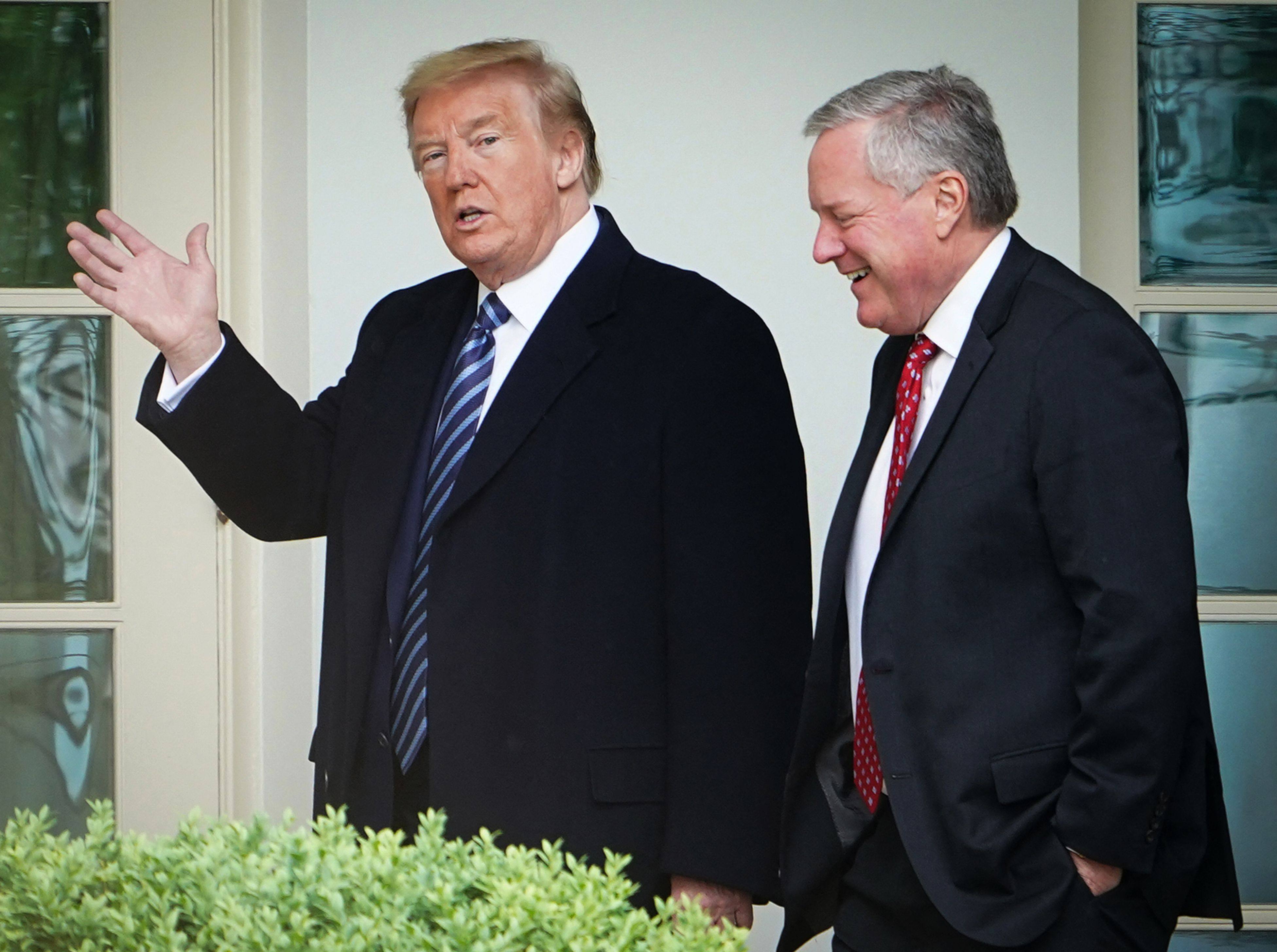 US President Donald Trump walks with Chief of Staff Mark Meadows in March 2020. Photo: AFP