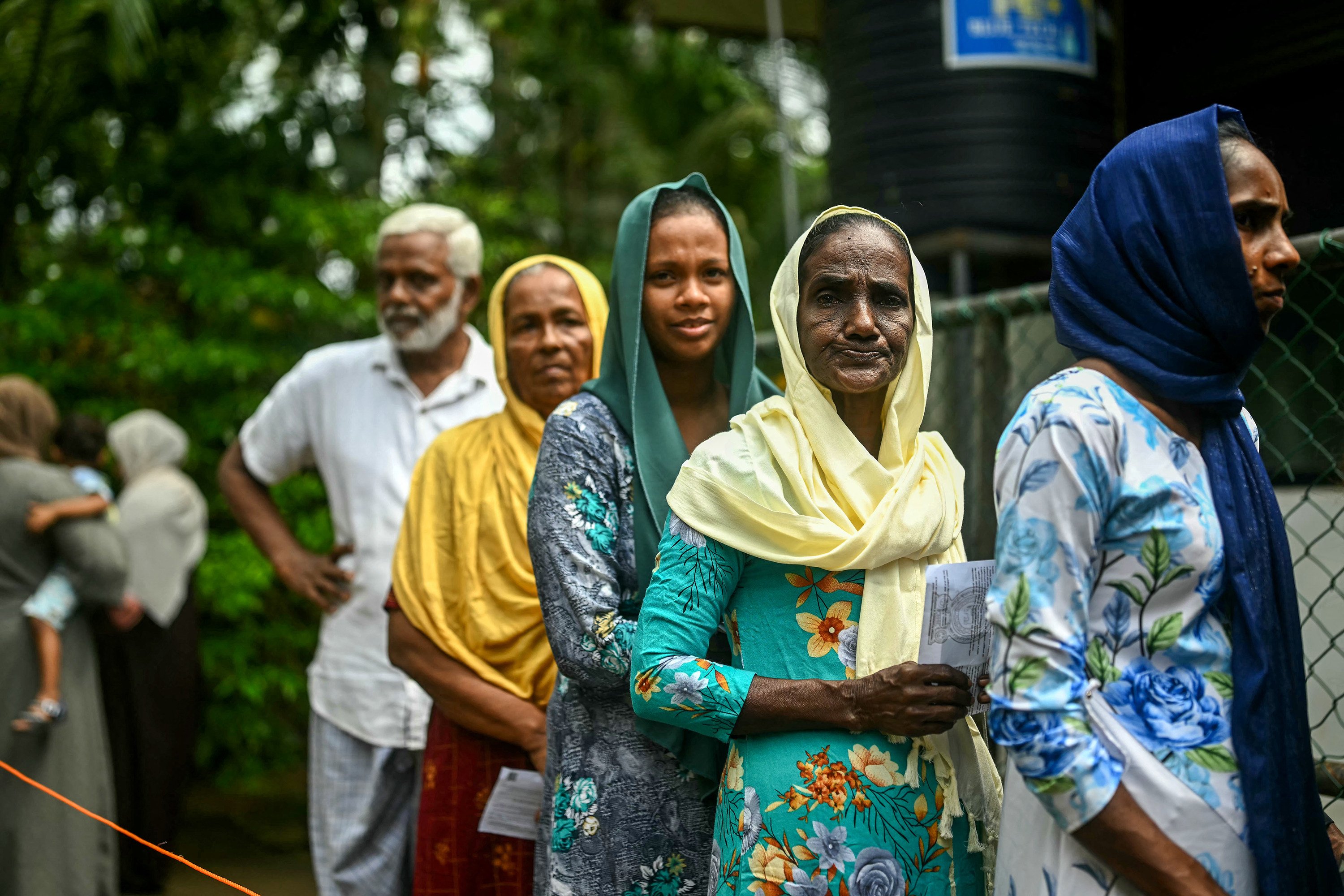 People wait in a queue to cast their ballots at a polling station during Sri Lanka’s presidential election in Galle on September 21. Photo: TNS