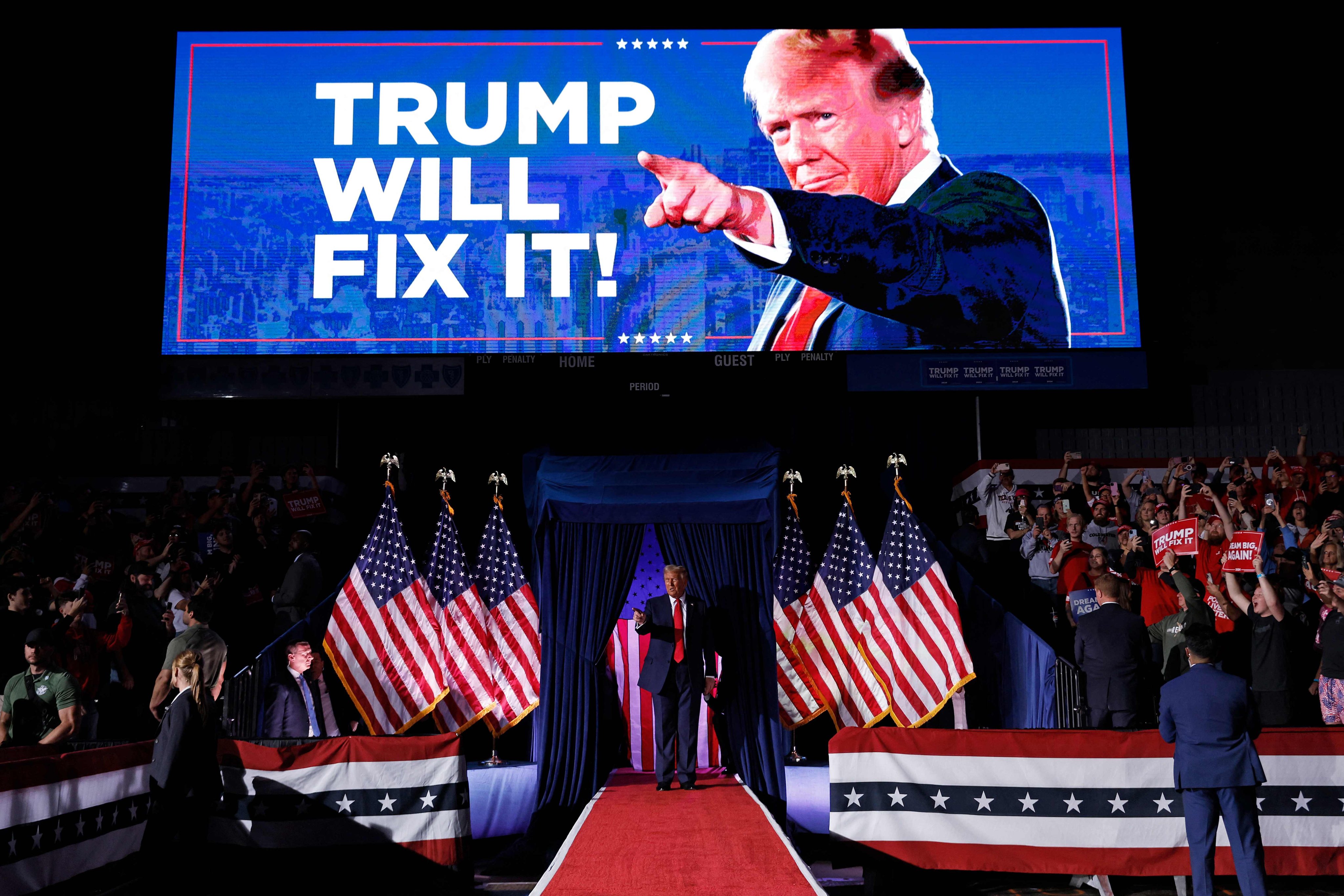 Donald Trump takes the stage for his rally at the Van Andel Arena in Grand Rapids, Michigan, on November 5. Photo: Getty Images via AFP