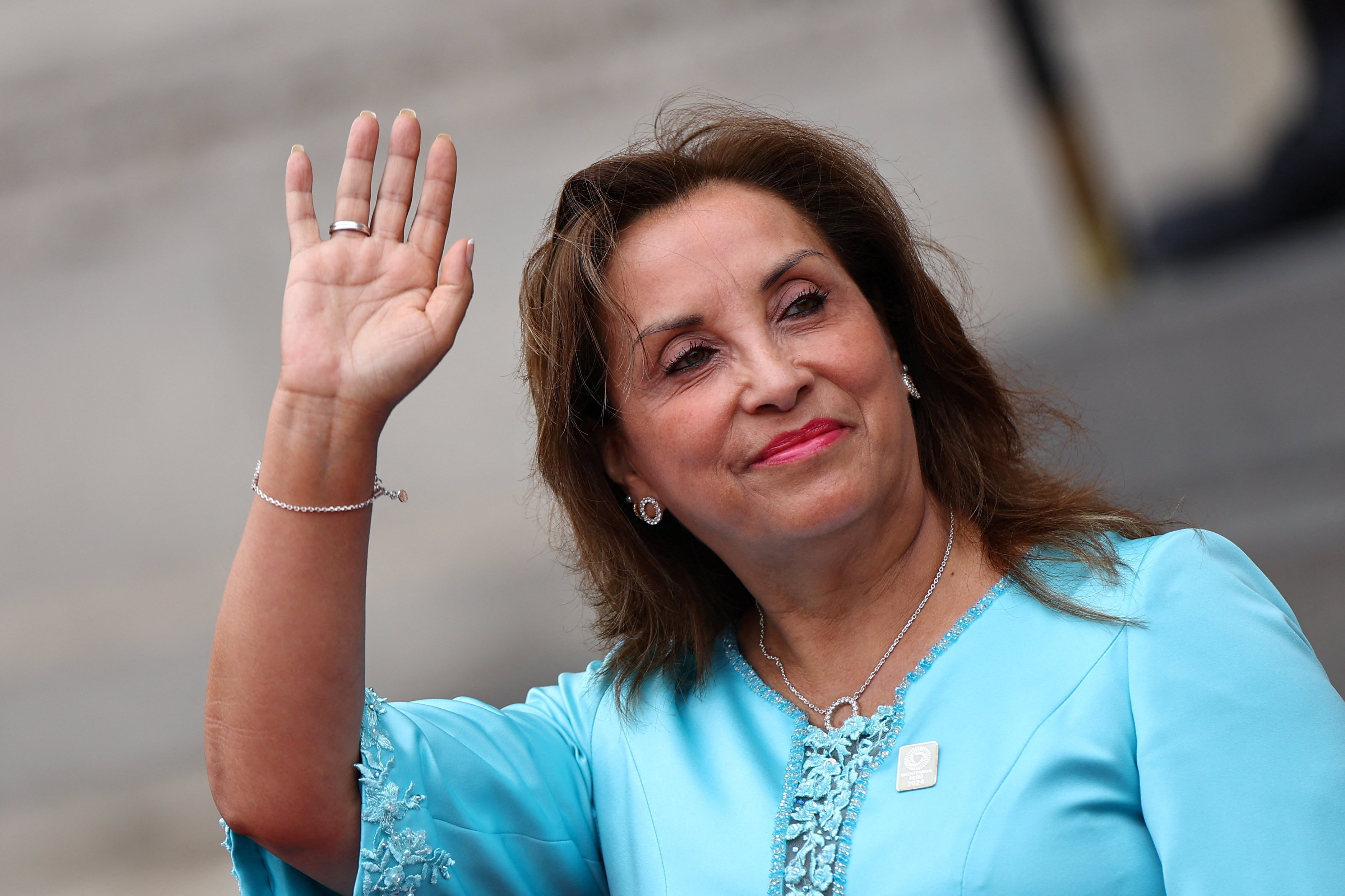 Peruvian President Dina Boluarte waves at the government palace in Lima on November 12, 2024. Peru is hosting this year’s summit of the Asia-Pacific Economic Cooperation, an intergovernmental group that promotes free trade. Photo: Reuters