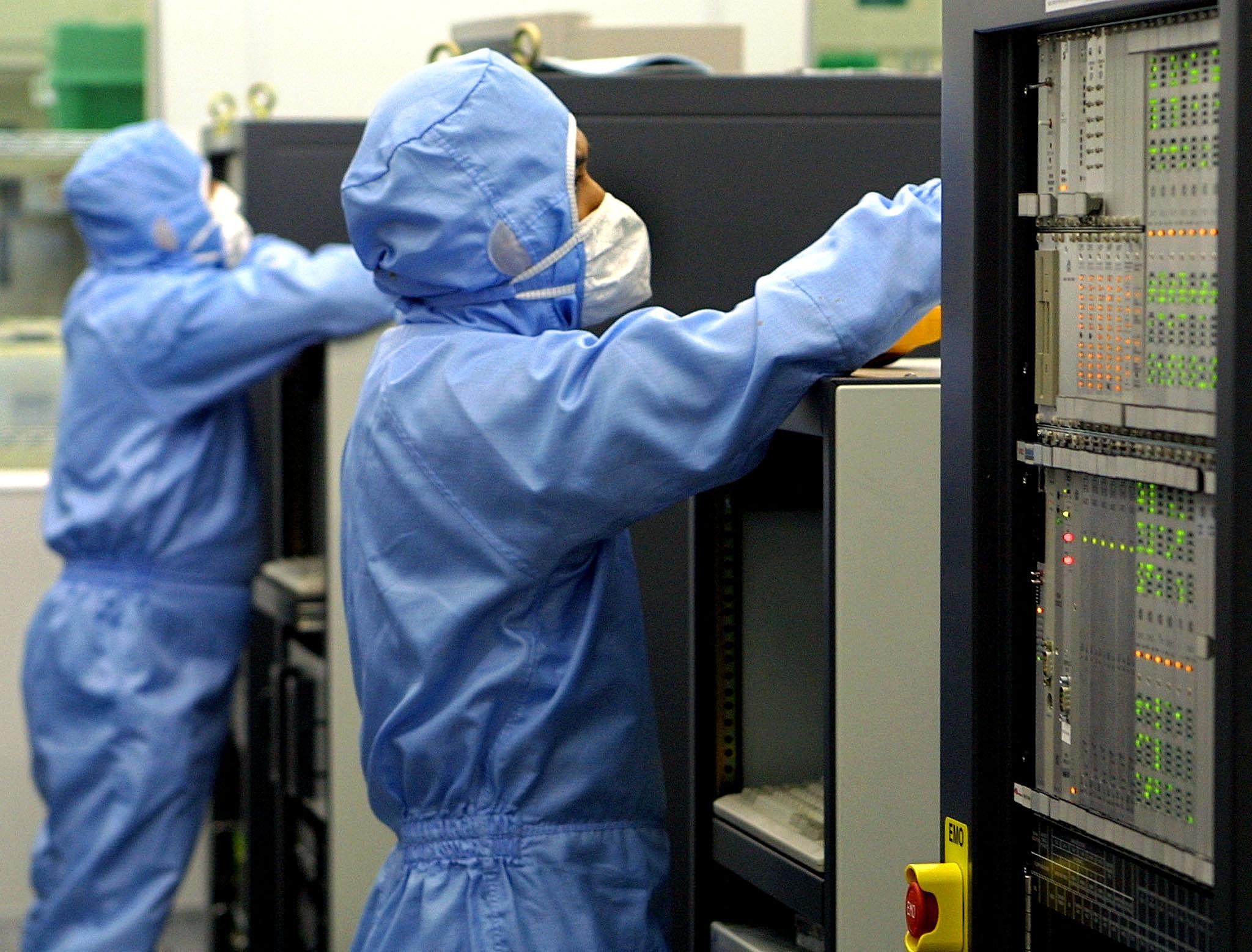 Technicians work at a semiconductor plant in Kuala Lumpur. Photo: AFP