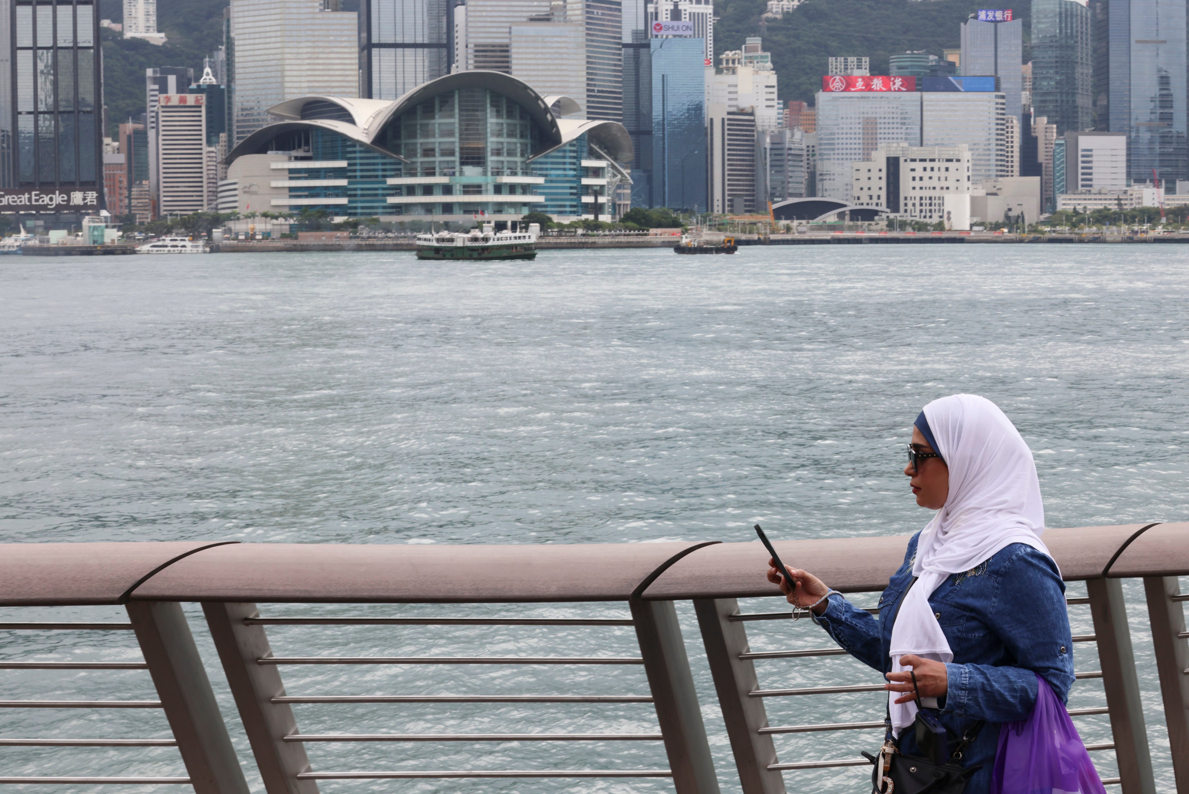 A Muslim tourist at the Tsim Sha Tsui waterfront – Hong Kong wants to encourage more Muslim visitors to come to the city. Photo: Jelly Tse