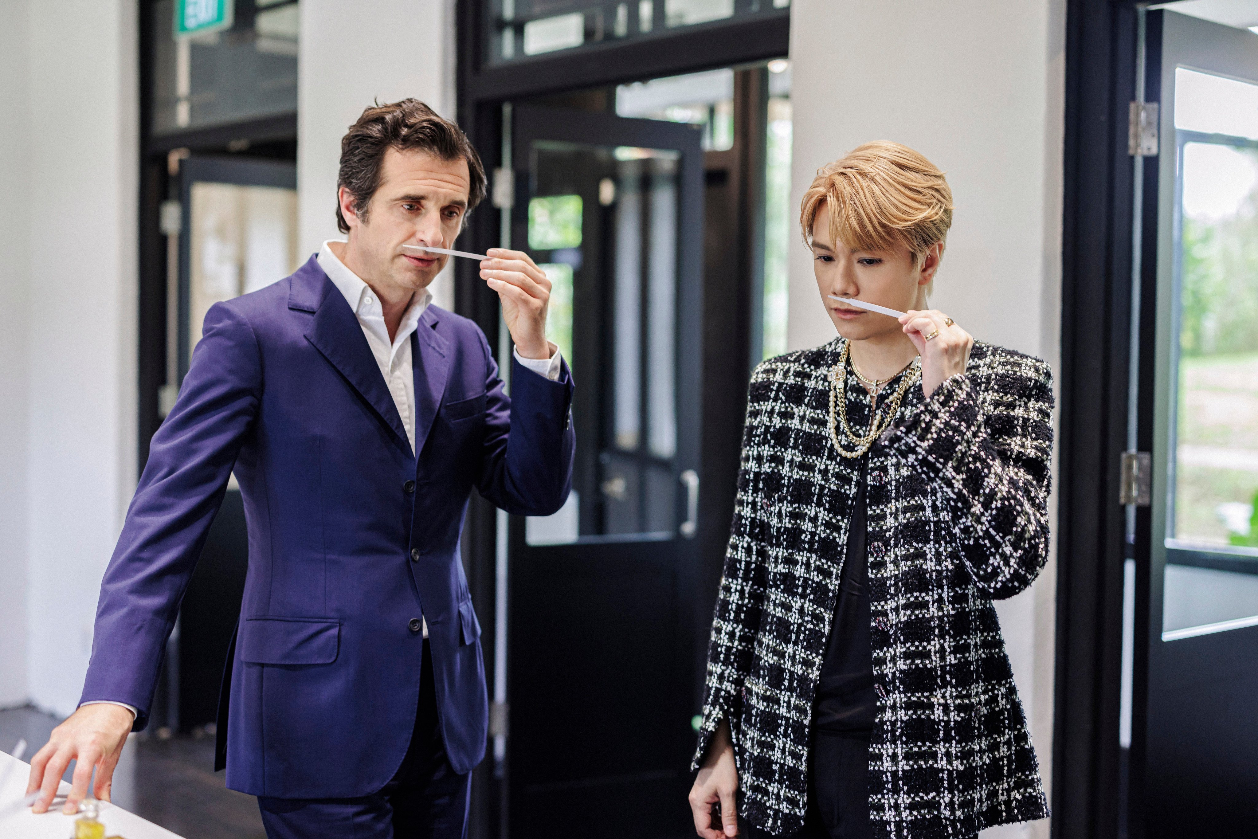 Olivier Polge (left), the fourth in-house master perfumer in Chanel’s history, samples scents with singer Hins Cheung in Singapore. Photo: Handout