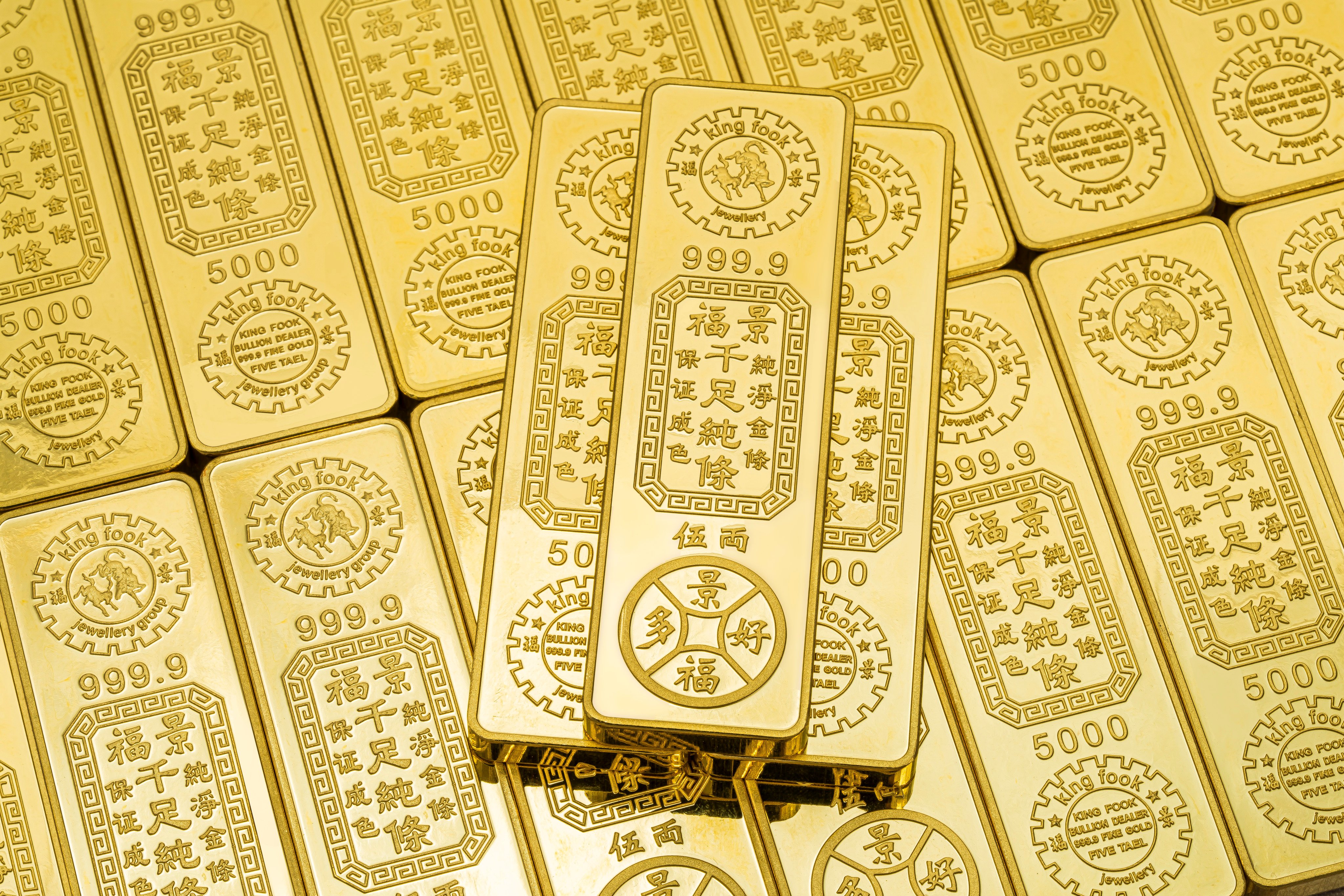 Hong Kong jeweller King Fook Jewellery is giving away 75 taels of gold bars for its 75th anniversary... in a lucky draw. Photo: Handout