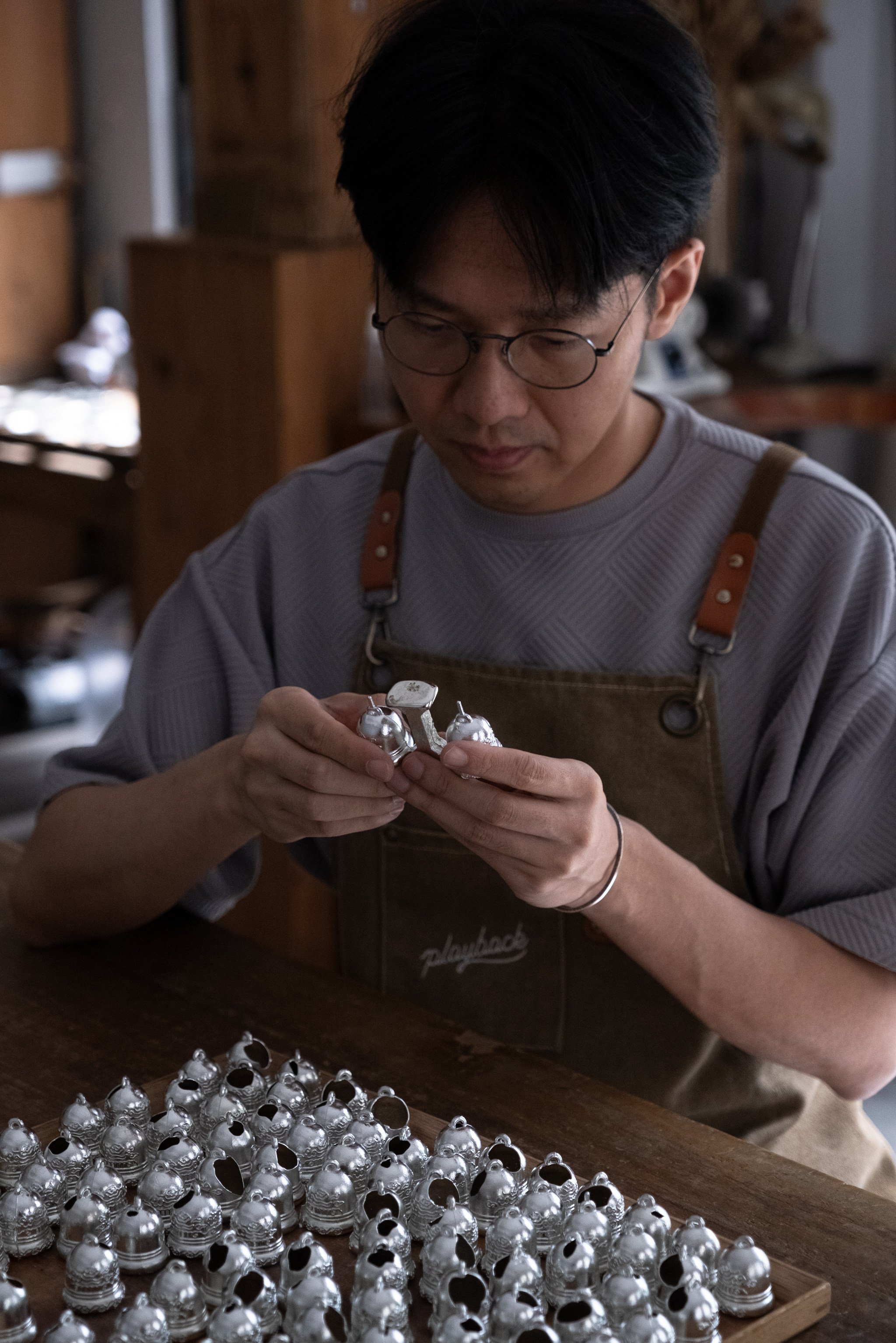 Artist Chan Po-fung works on one of his art pieces. Photo: Handout 