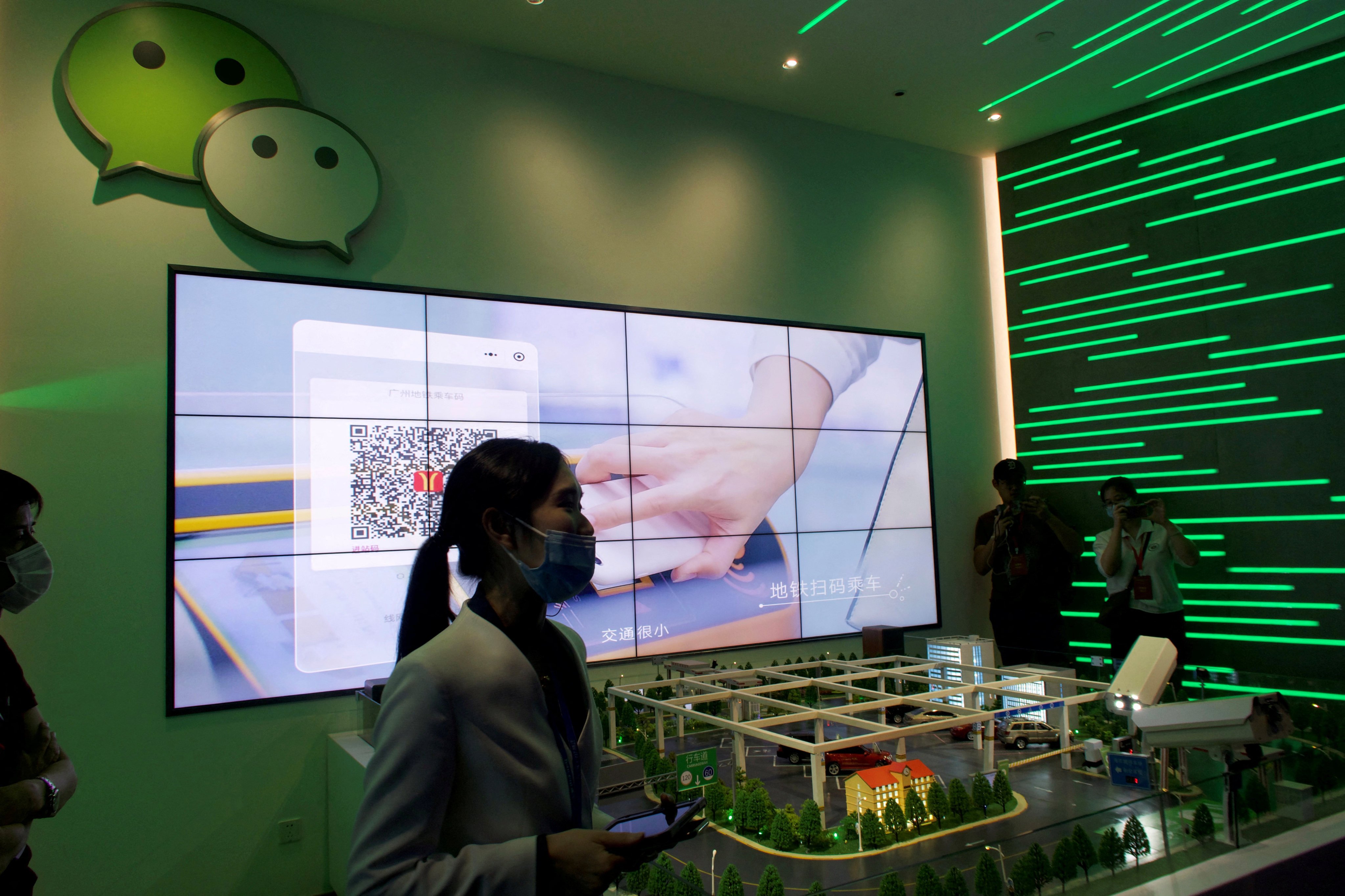 A staff member introduces WeChat services during a government-organised media tour to Tencent headquarters in Shenzhen on September 27, 2020. Photo: Reuters