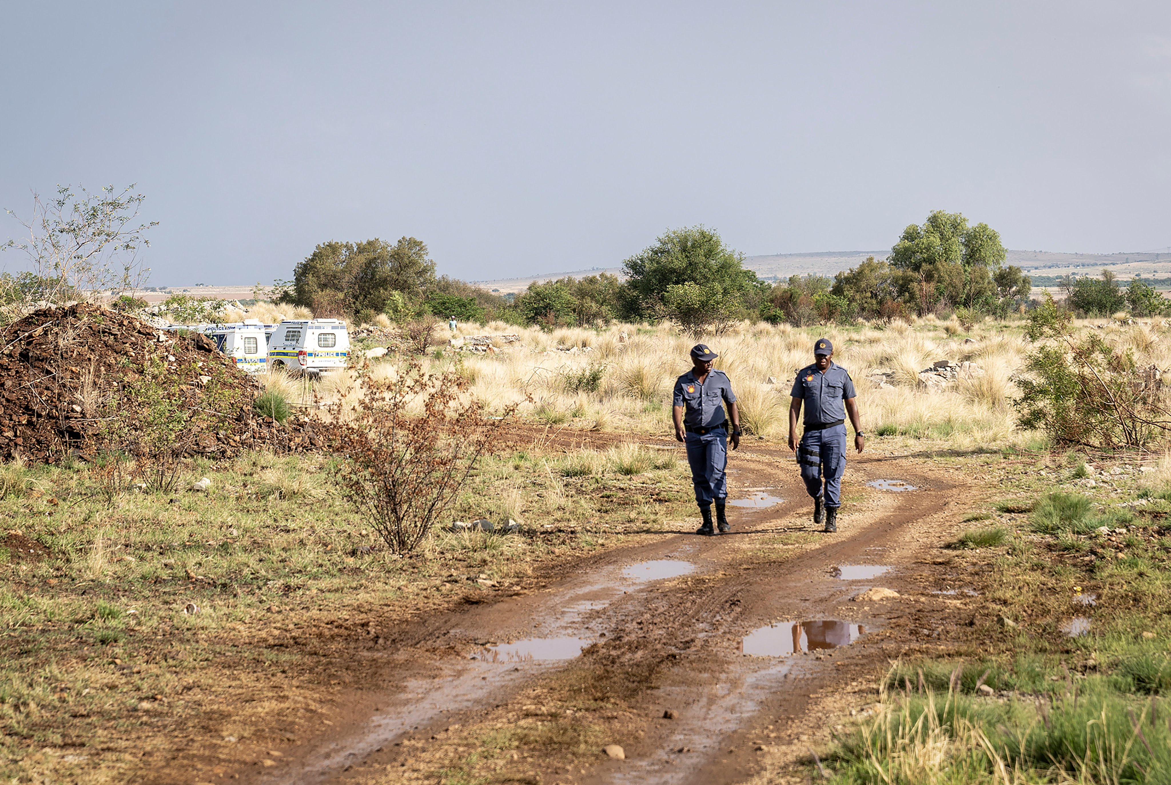 Police patrol at a South African mine shaft where an estimated 4,000 illegal miners are trapped. Photo: AP