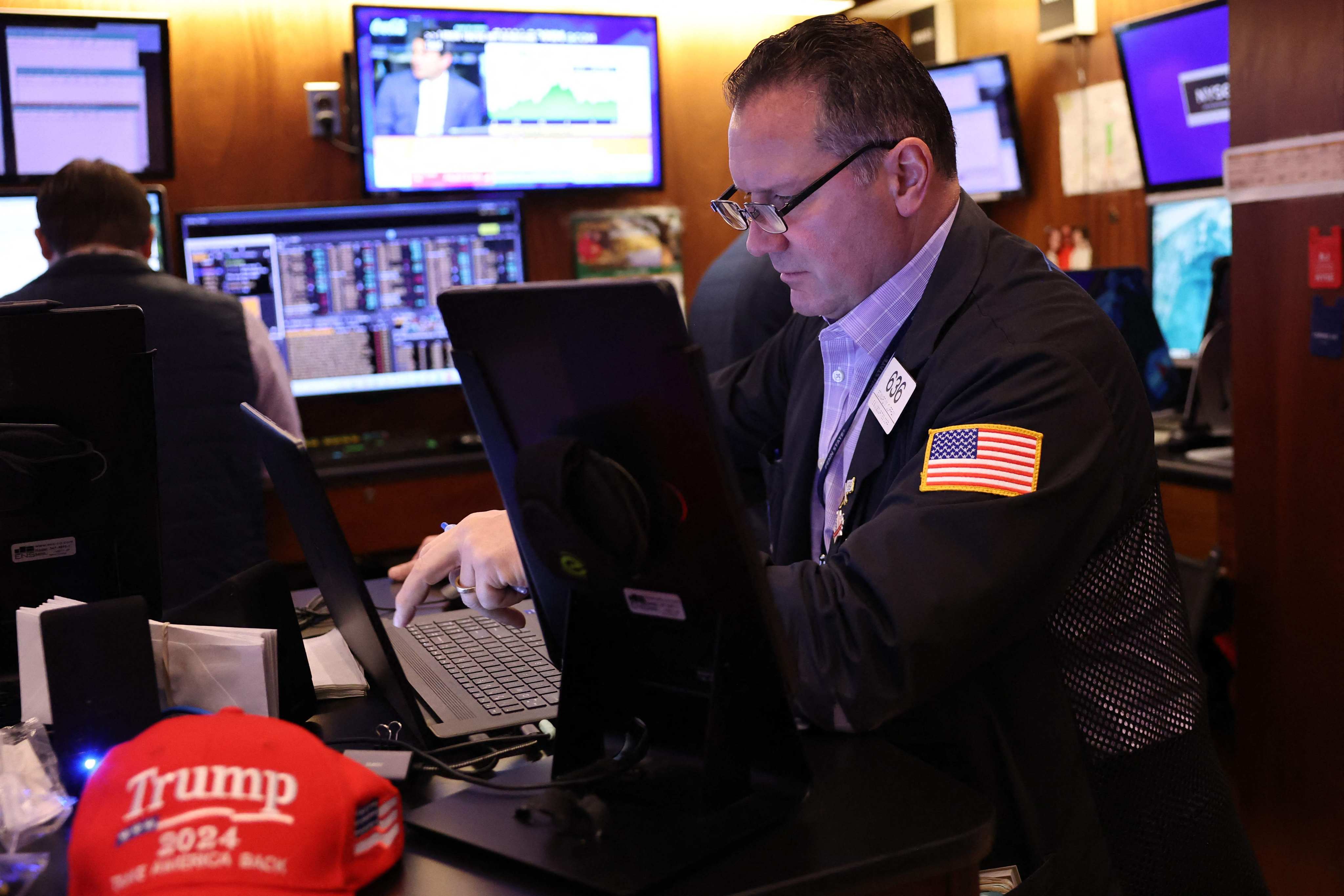 Traders work on the floor of the New York Stock Exchange during the morning trading on November 7. The Dow Jones Index closed up more than 1,500 points following former US president Donald Trump’s win in the 2024 presidential election, the market’s biggest jump in two years. Photo: AFP