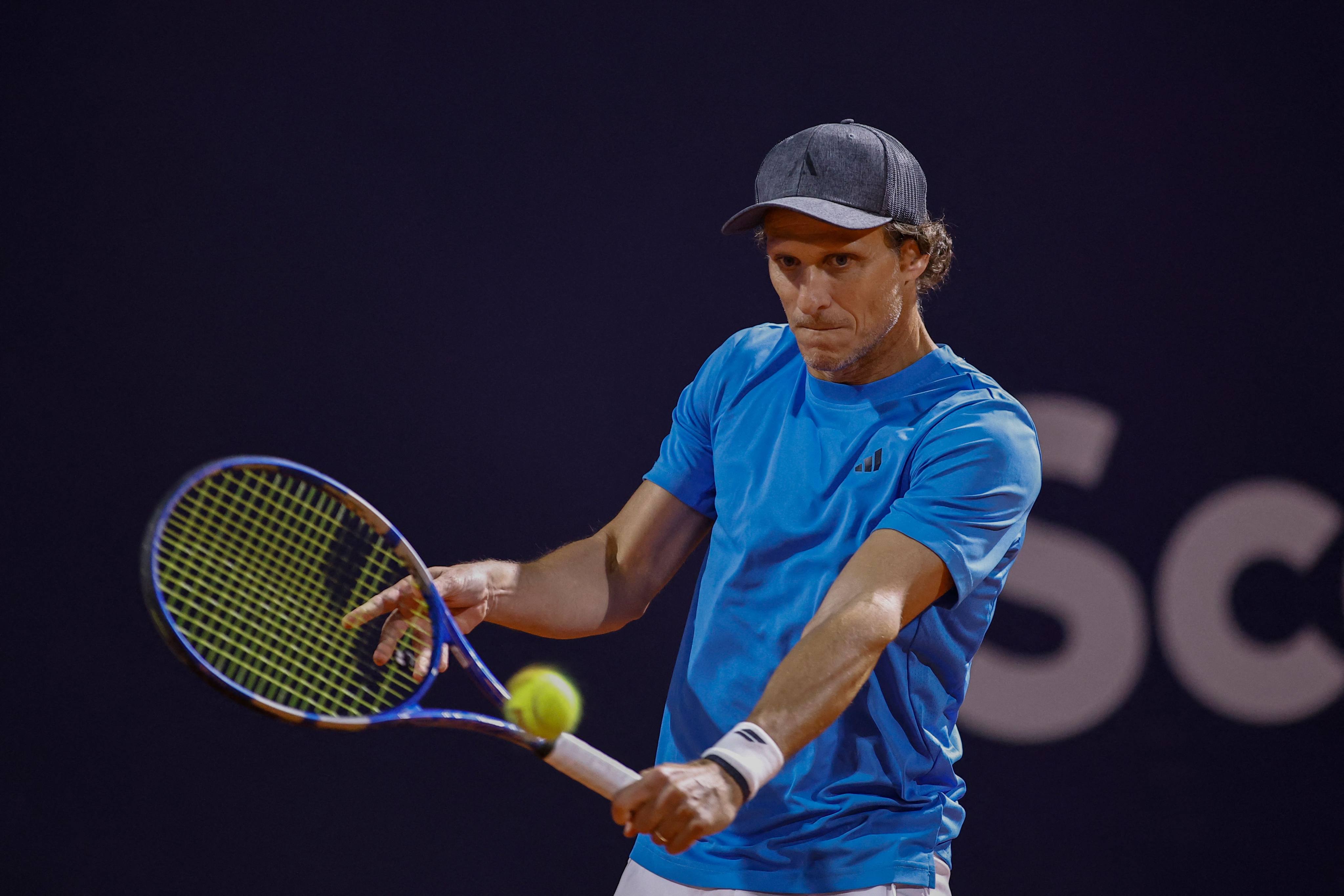 Diego Forlan, the 45-year-old former Manchester United, Uruguay and Atletico Madrid footballer, playing in his professional tennis debut in a doubles match at the 2024 Uruguay Open. Photo: AFP