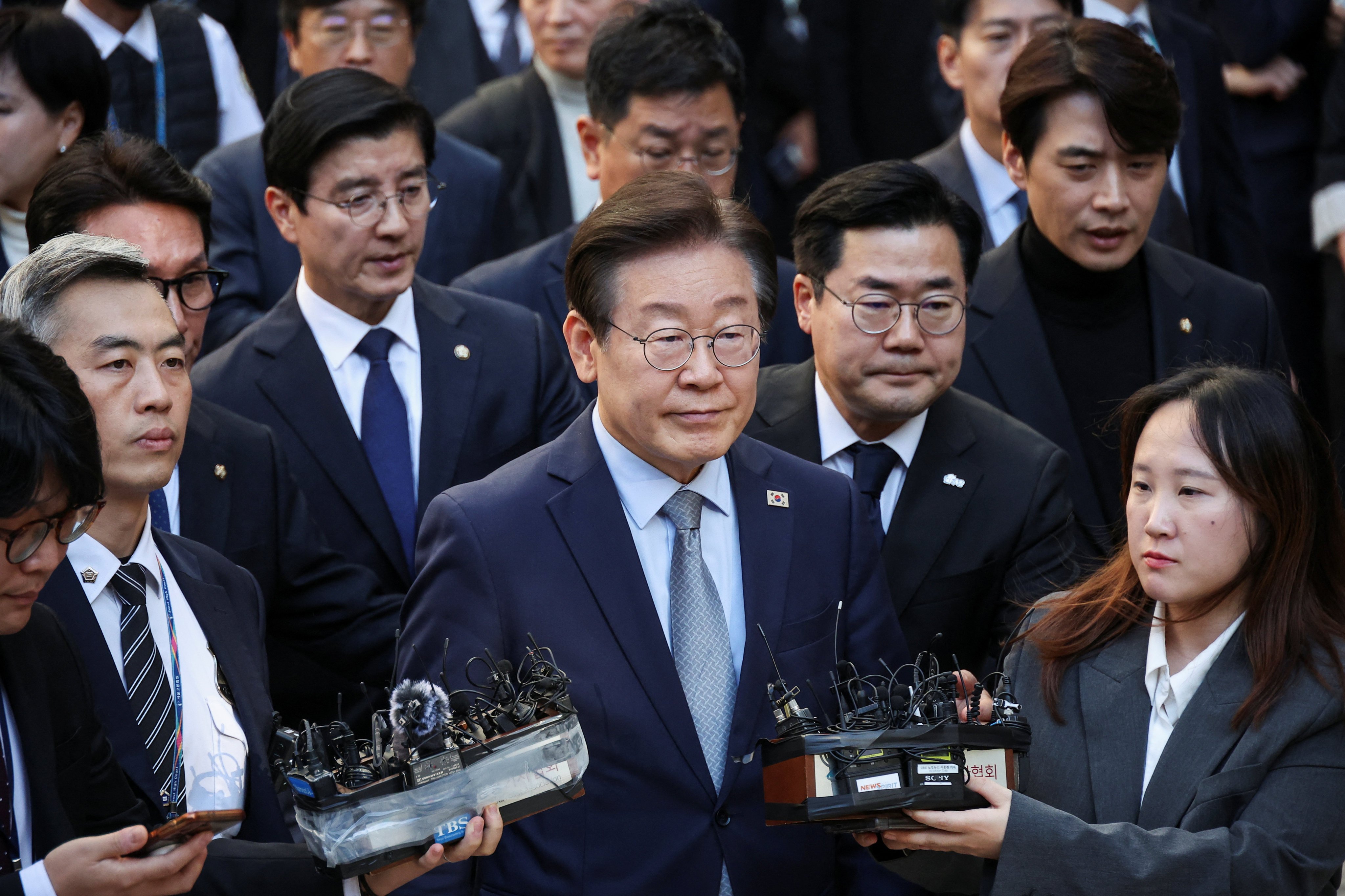 South Korea’s opposition chief Lee Jae-myung (centre) leaves a Seoul court on Friday. Photo: Reuters