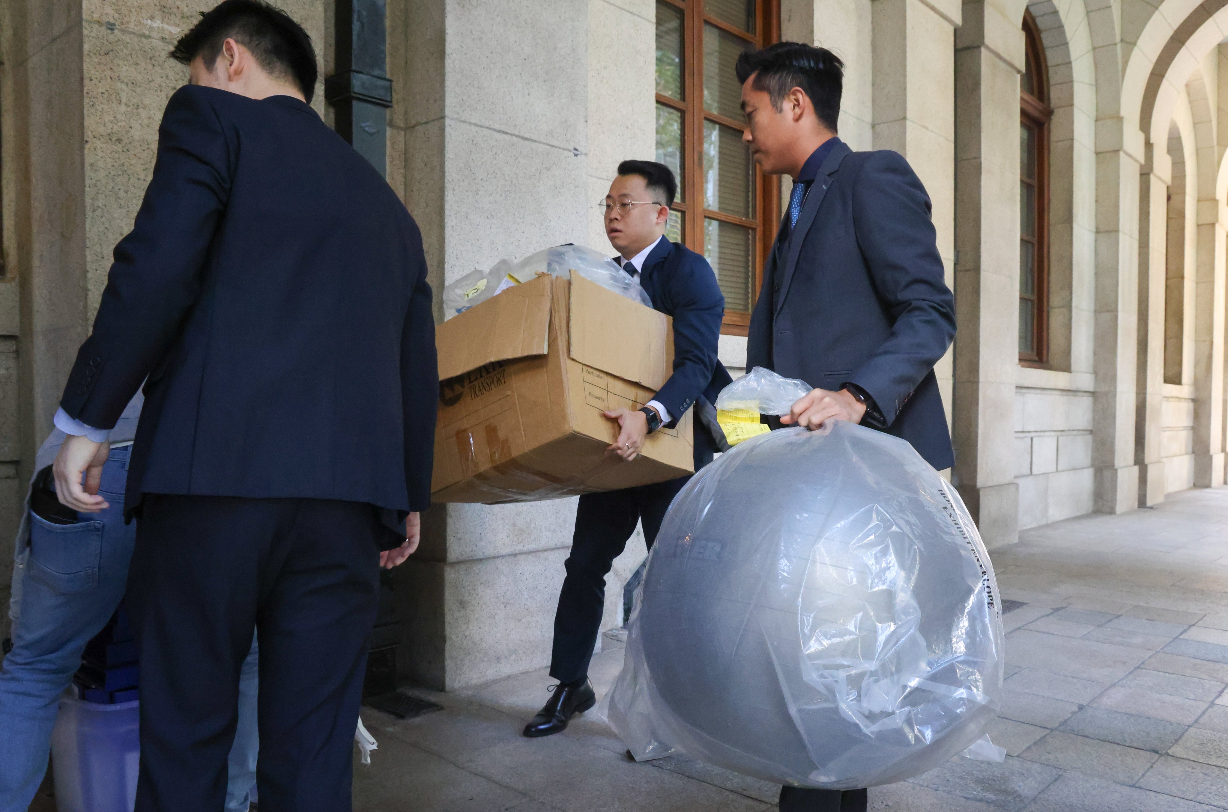 Evidence in the yoga ball murder case is taken away following previous legal proceedings. Photo: Dickson Lee