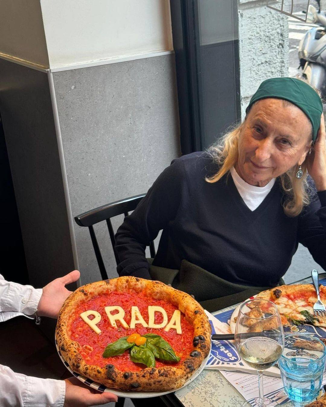 Miuccia Prada was surprised with a “Prada pizza” in Naples as documented by @whatmiuccia, a fan Instagram account. Photo: @whatmiuccia/Instagram
