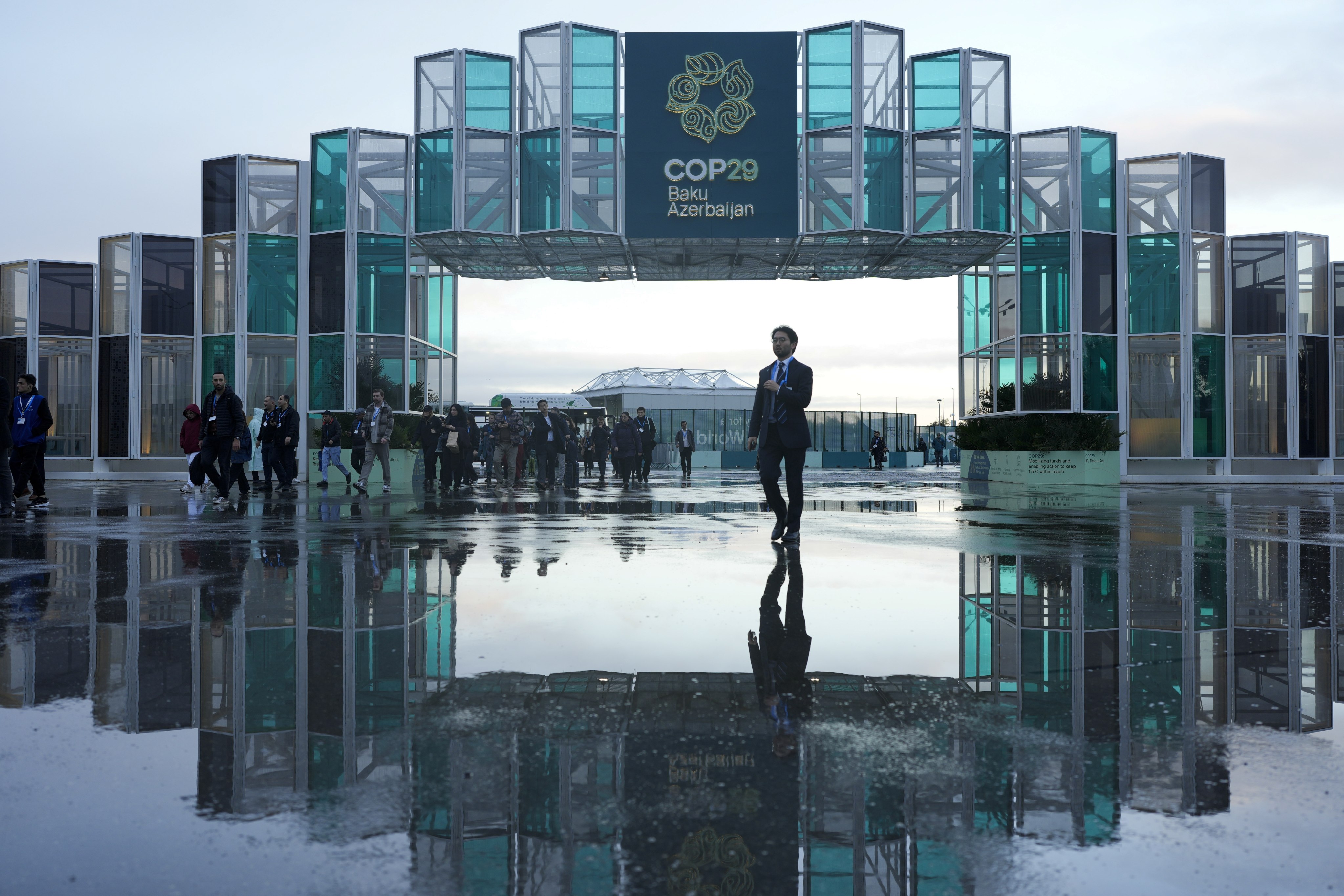 Attendees arrive for the Cop29 UN climate summit in Baku, Azerbaijan, on Thursday. Photo: AP