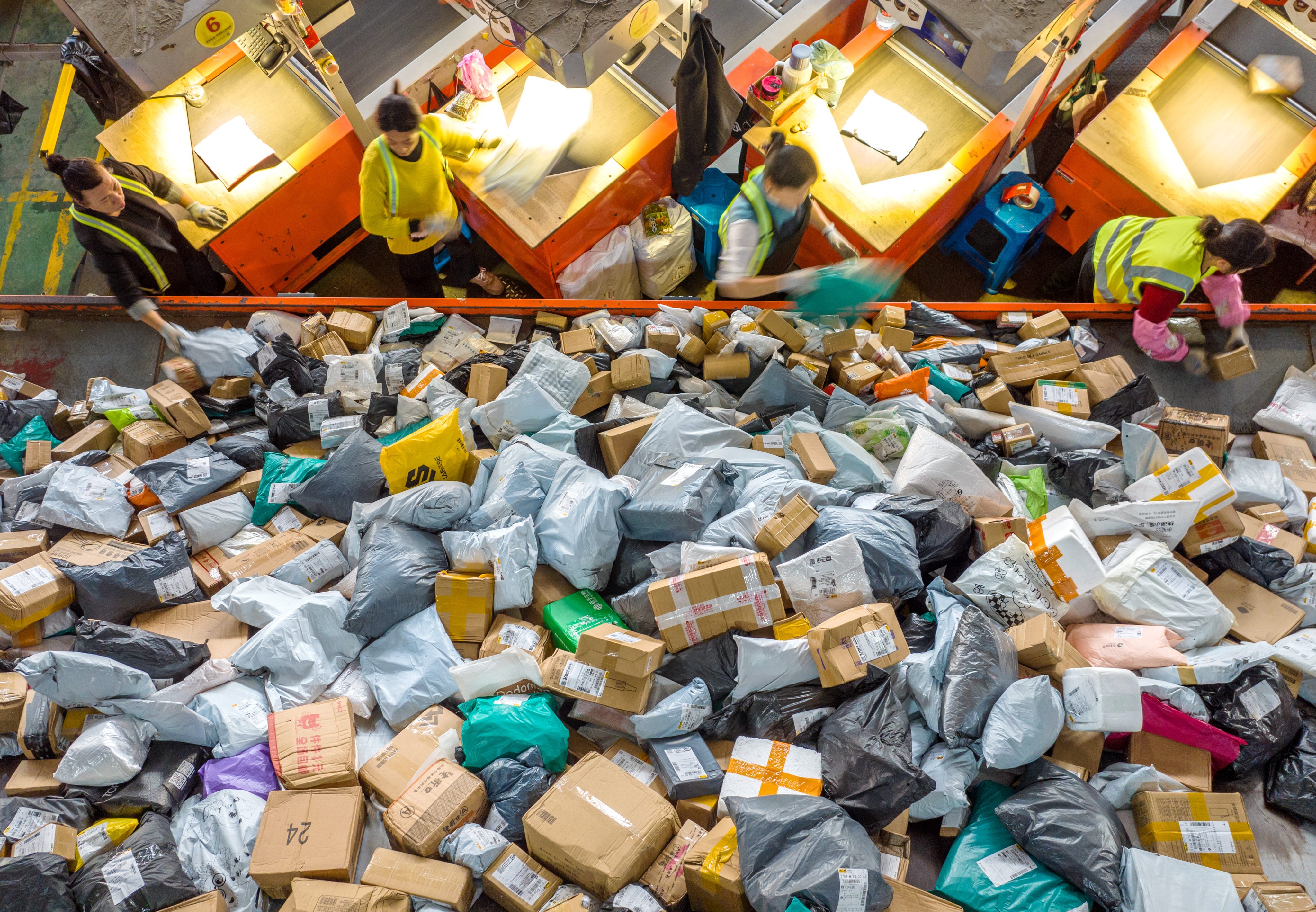 Workers sort packages at a logistics company in Huzhou city, Zhejiang province during the Singles’ Day shopping festival. Photo: Xinhua