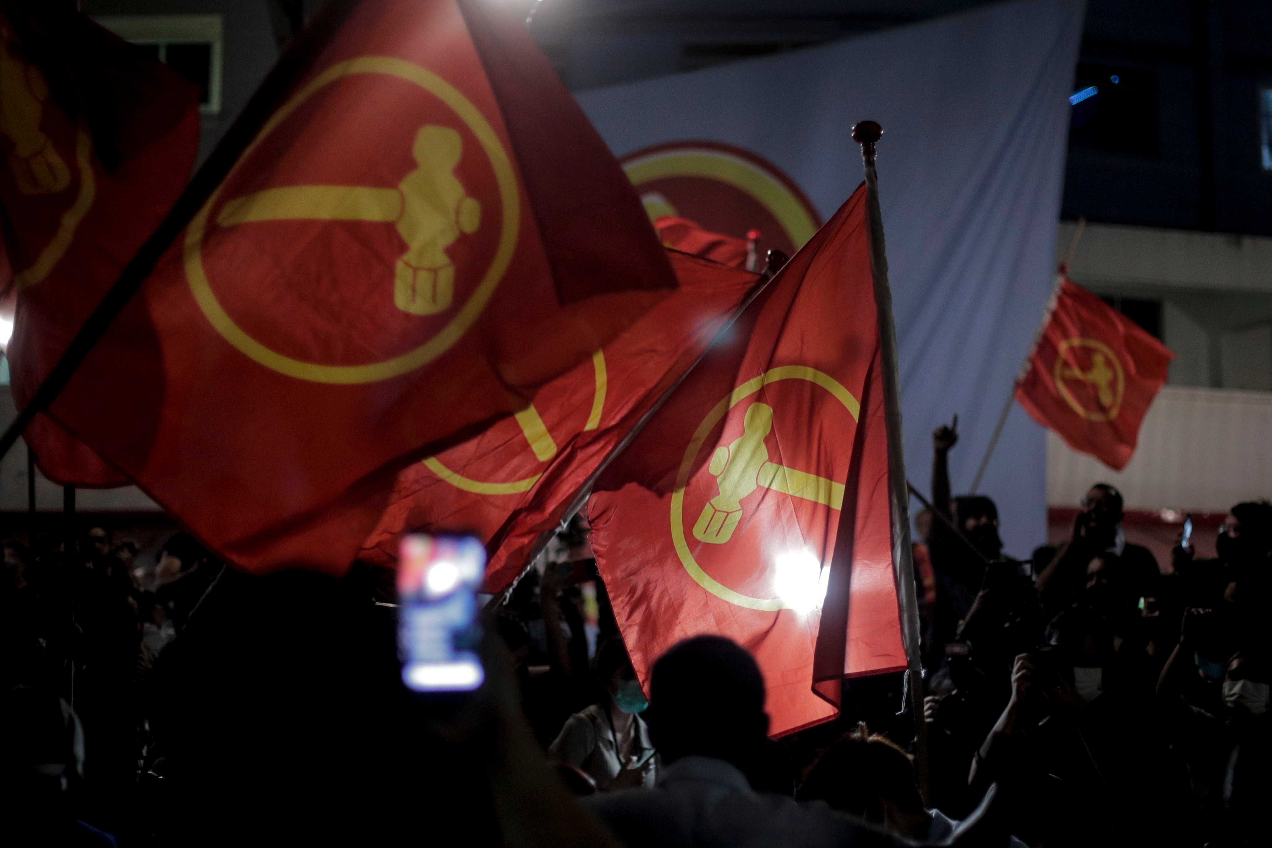 Supporters of the opposition Workers’ Party wave party flags in Singapore in 2020. Photo: EPA-EFE