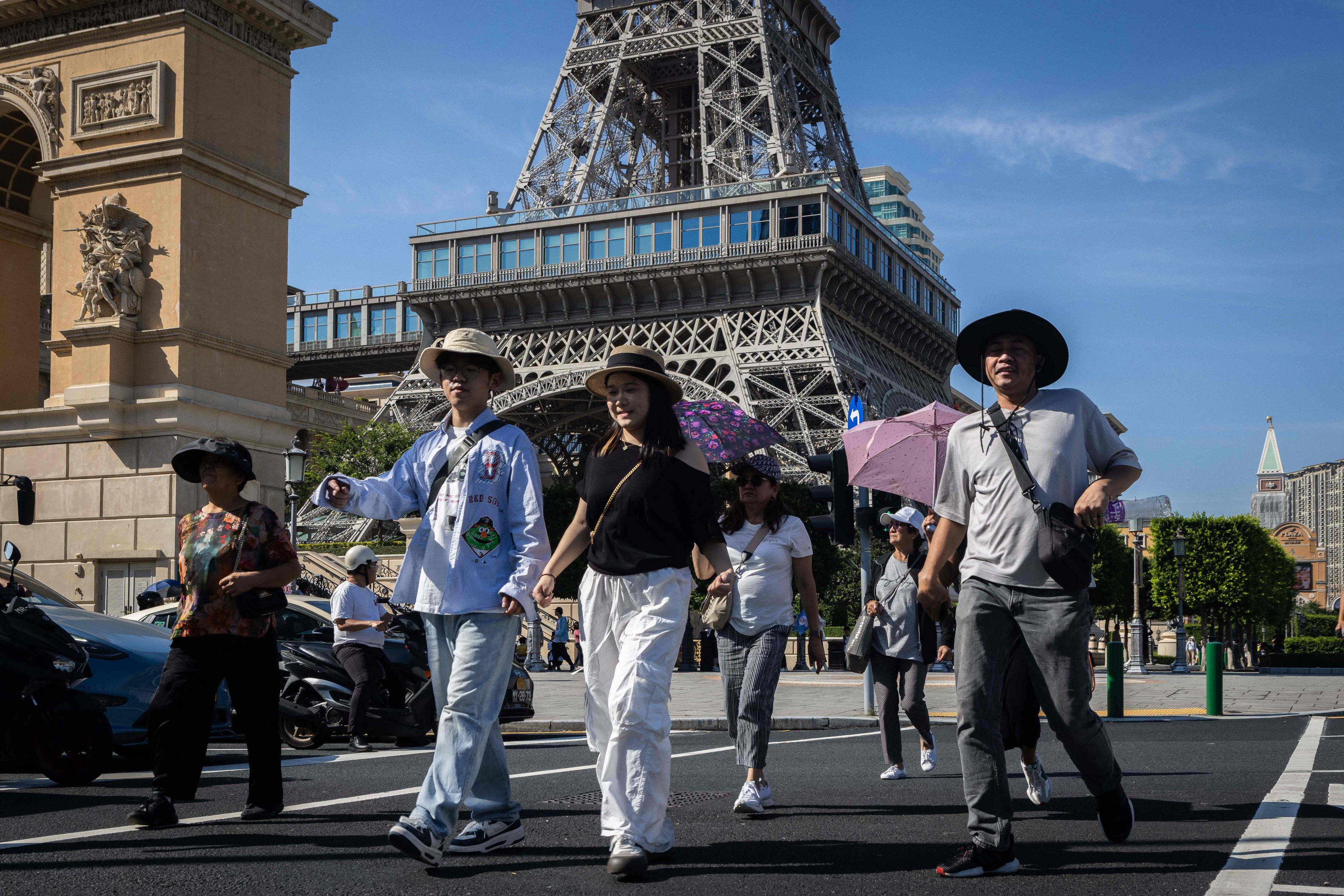 Visitors walk by a replica of the Eiffel Tower at the Parisian Macao. According to official data, 25.92 million visitors entered Macau in the first ninth months of this year, with most coming from the mainland and Hong Kong. Photo: AFP