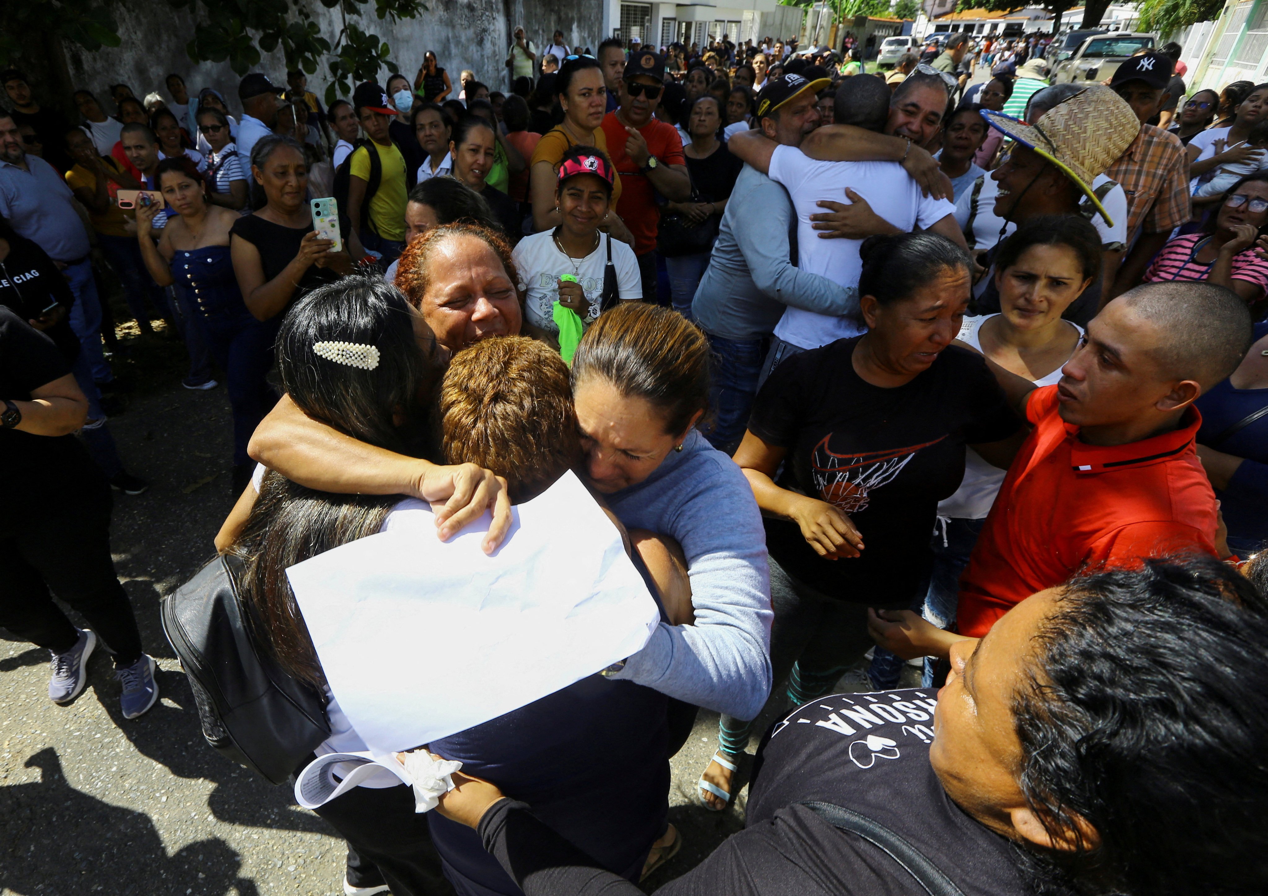 People receive their loved ones following their release after being arrested during protests over the disputed Venezuelan elections. Photo: Reuters