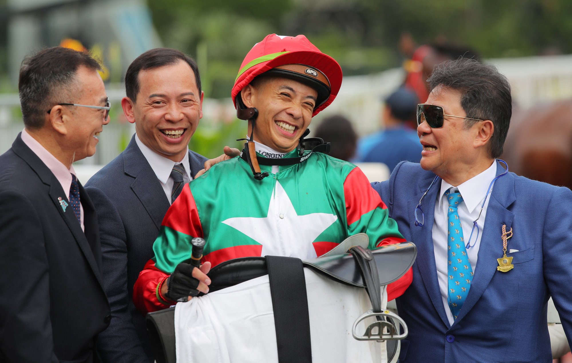 Trainer Cody Mo (second from left), jockey Derek Leung and connections of Markwin.