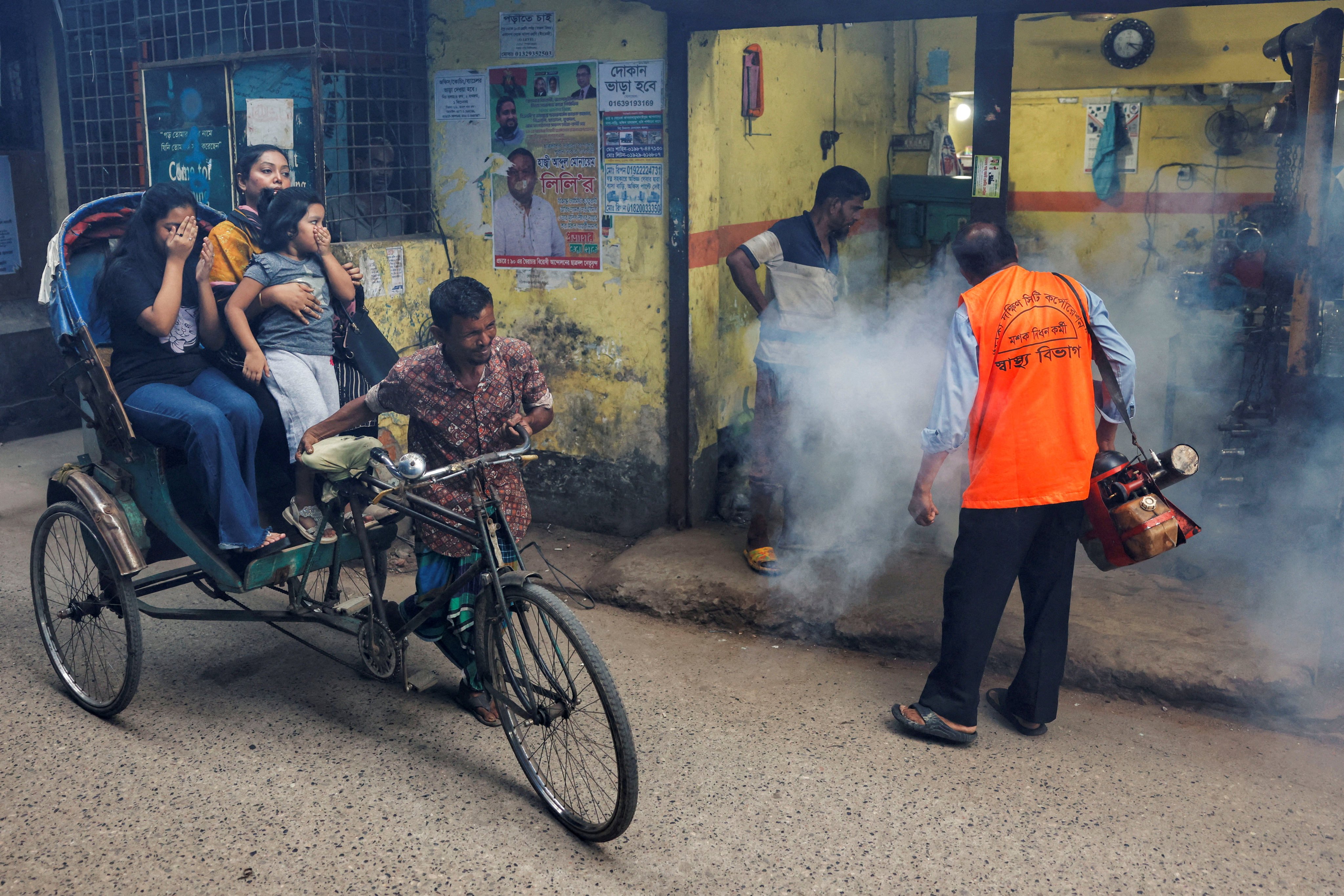 A city corporation worker sprays fumigator to control mosquitoes, as number of dengue infected patients increase, in Bangladesh. File photo: Reuters