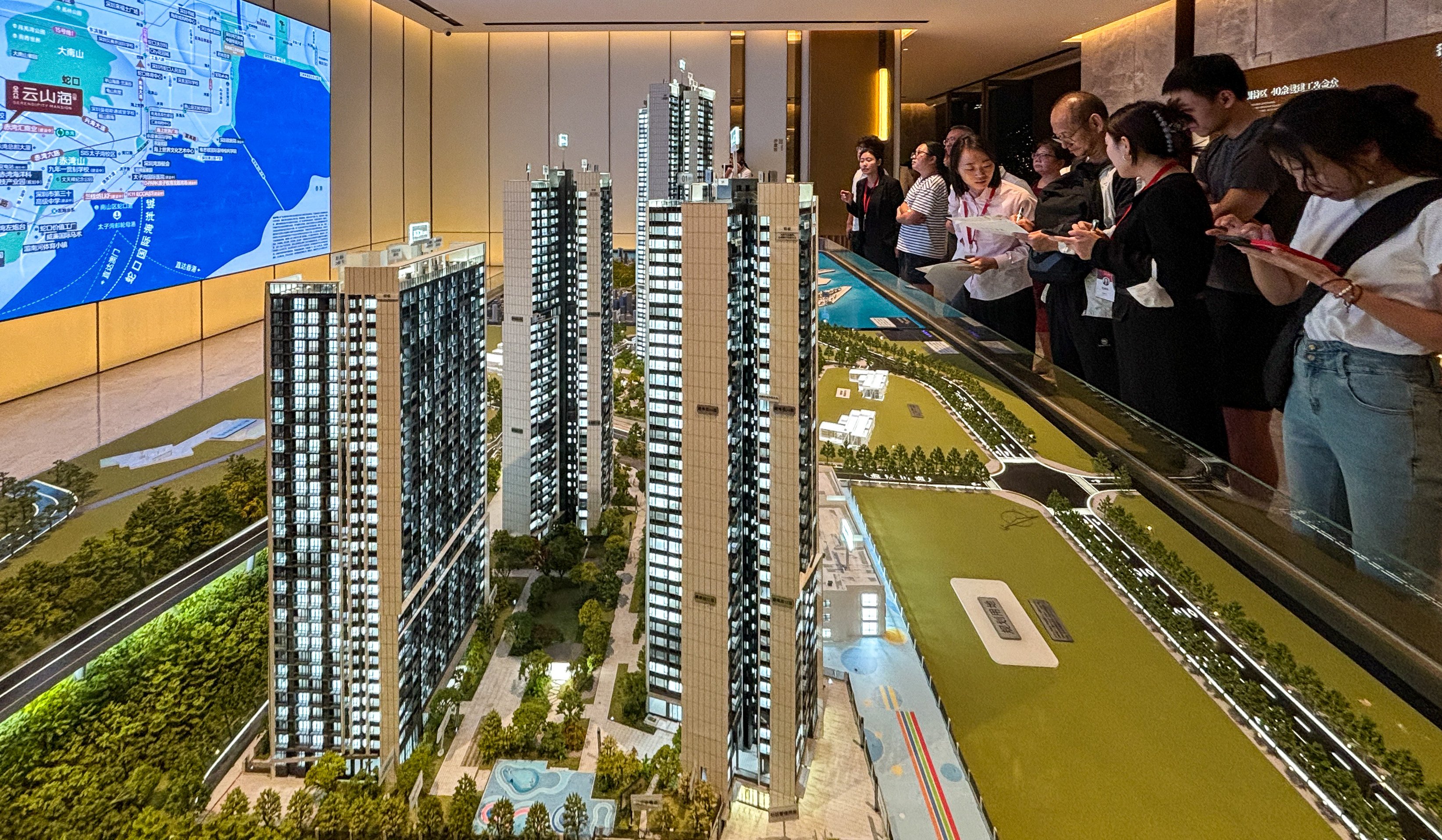 Homebuyers seen inside a property showroom in Nanshan district, Shenzhen on October 3. Photo: Yulu Ao