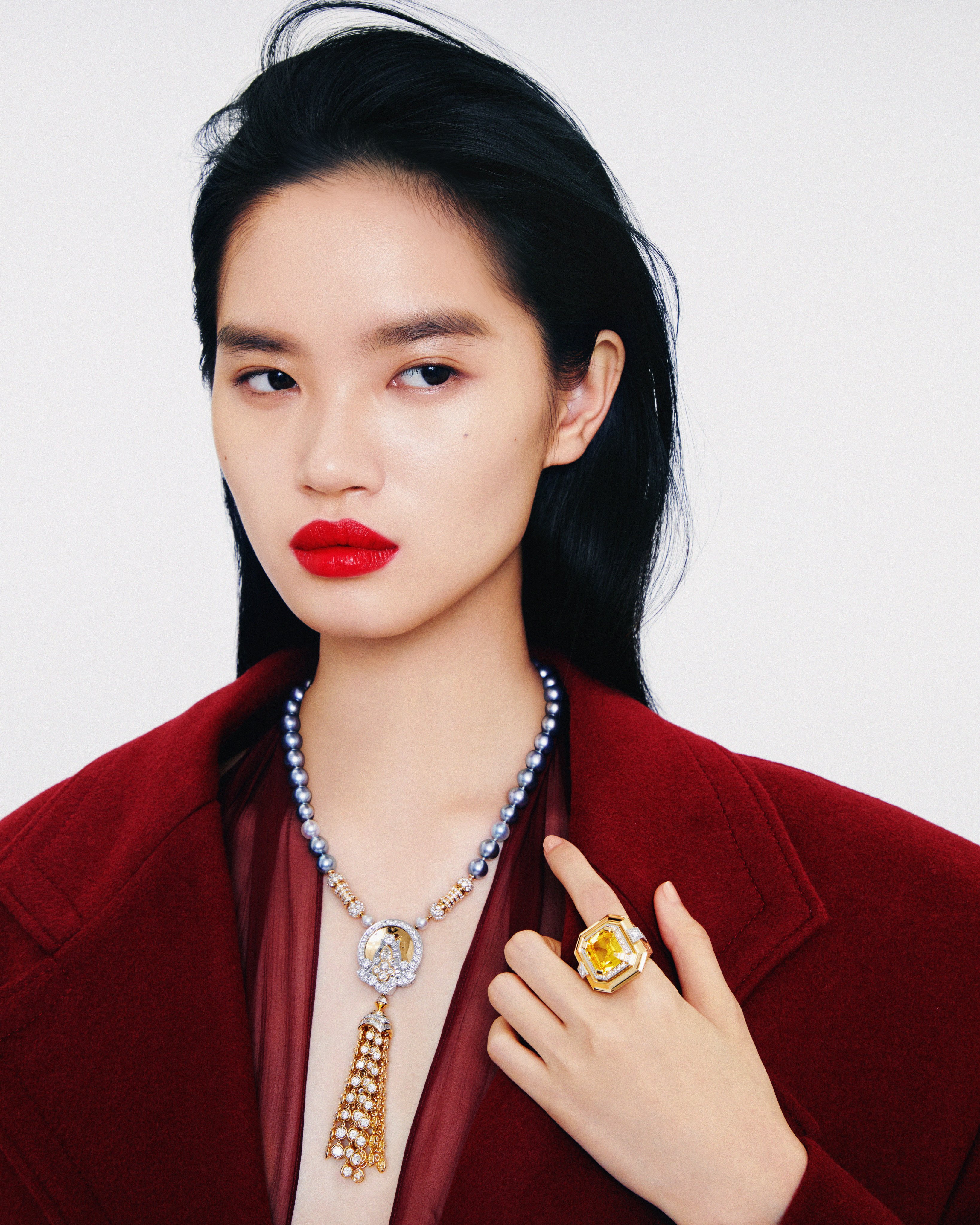 Van Cleef & Arpels: necklace, ring; Ferragamo: coat, dress. Photo: Olivia Tsang