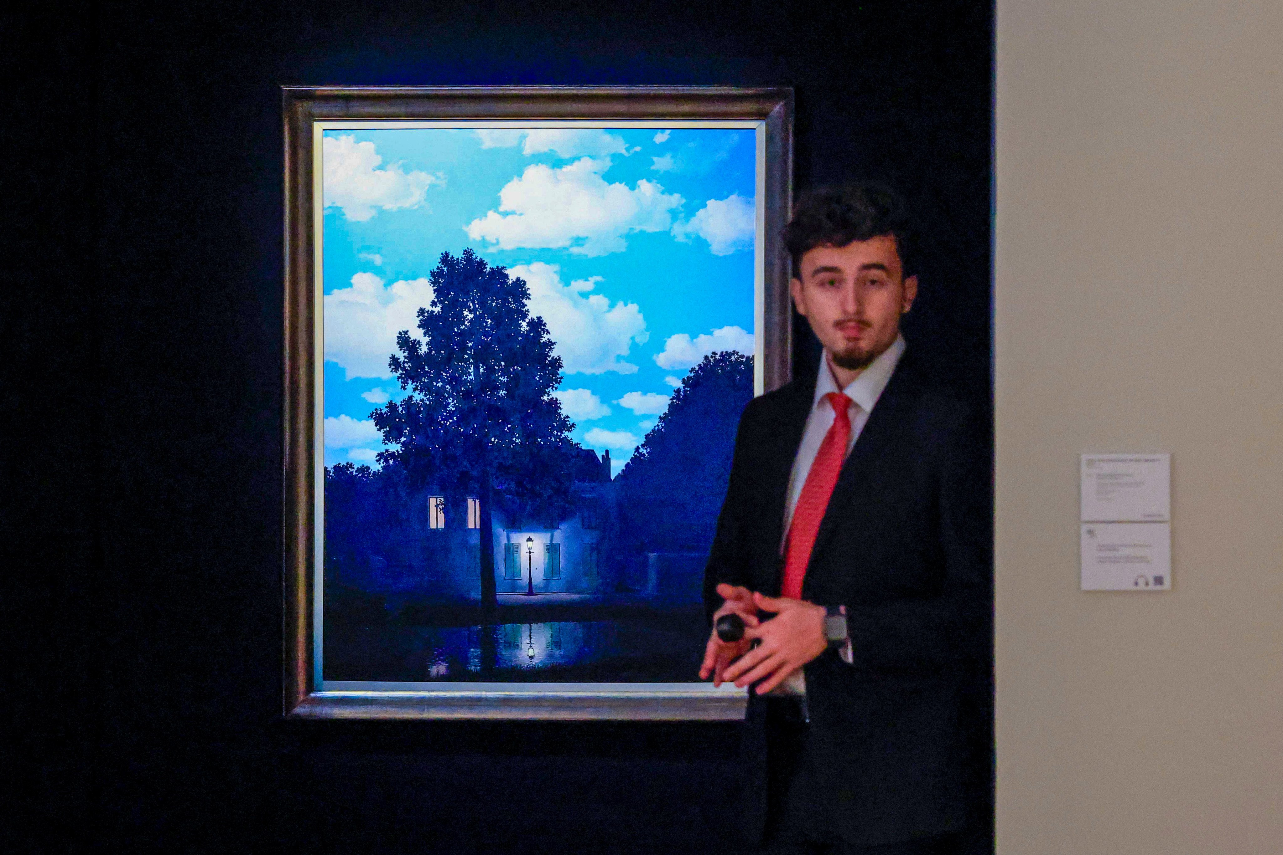 One of Rene Magritte’s Empire of Light paintings from 1954 is displayed during a preview for a November 19 Christie’s auction in New York. Photo: AFP