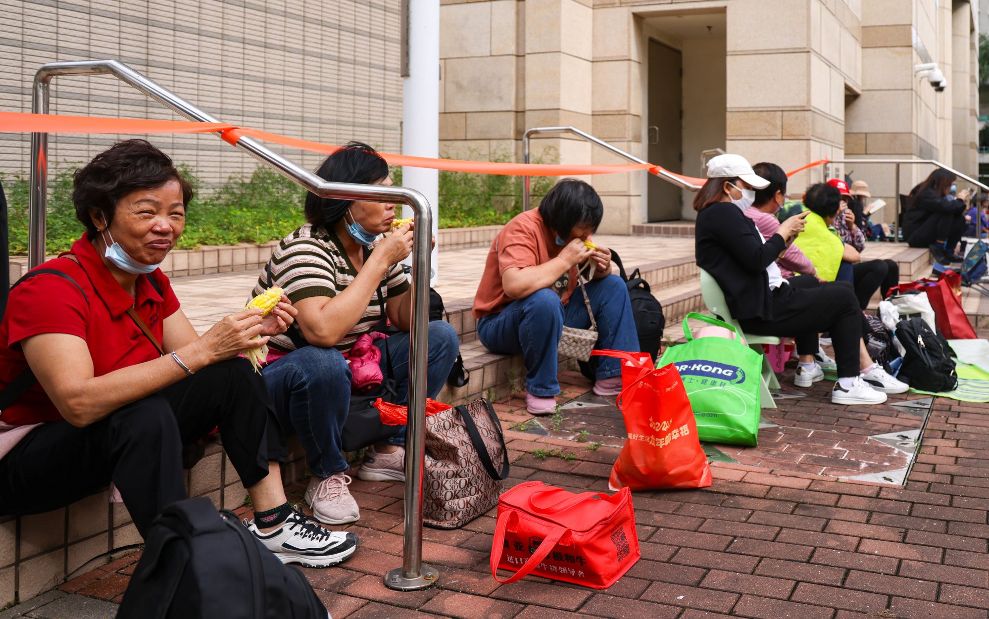 Residents queue outside West Kowloon Court in Cheung Sha Wan ahead of the trial’s sentencing hearing set for Tuesday. Photo: Eugene Lee