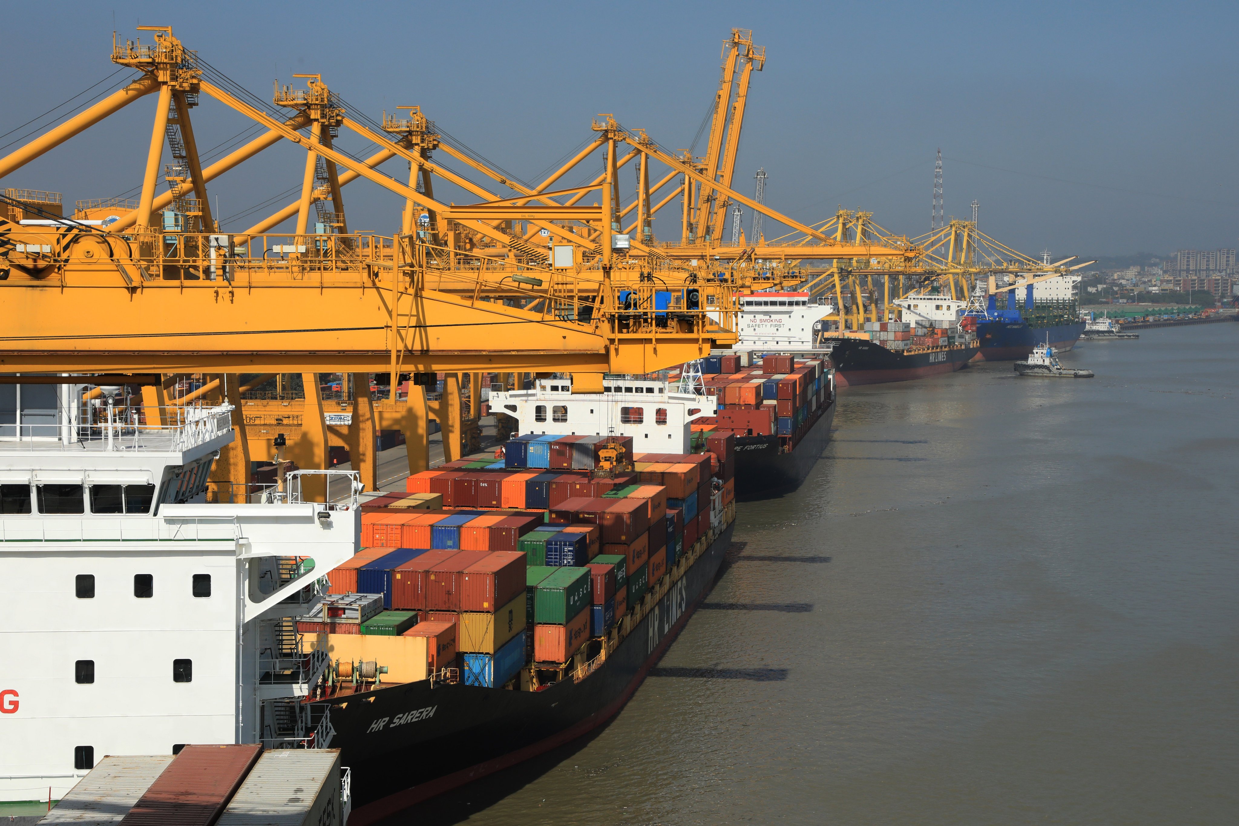 Containers and shipyard cranes at Chittagong Port in Bangladesh. Photo: SOPA Images/LightRocket via Getty Images