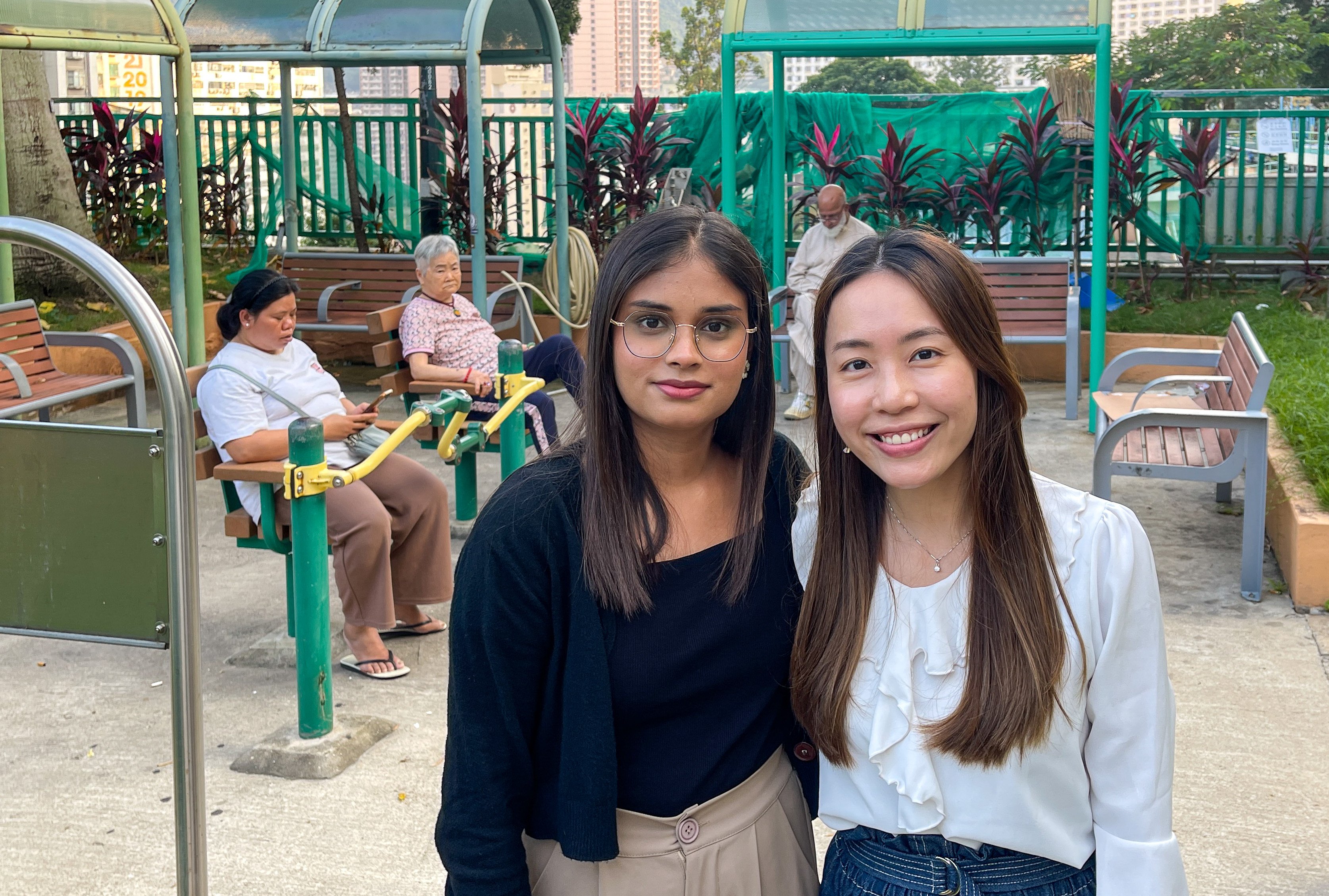 Kaur Kirandeep (left) and Emily Yeung help elderly people from ethnic minority groups in Hong Kong feel more connected to their neighbours. Photo: Cindy Sui