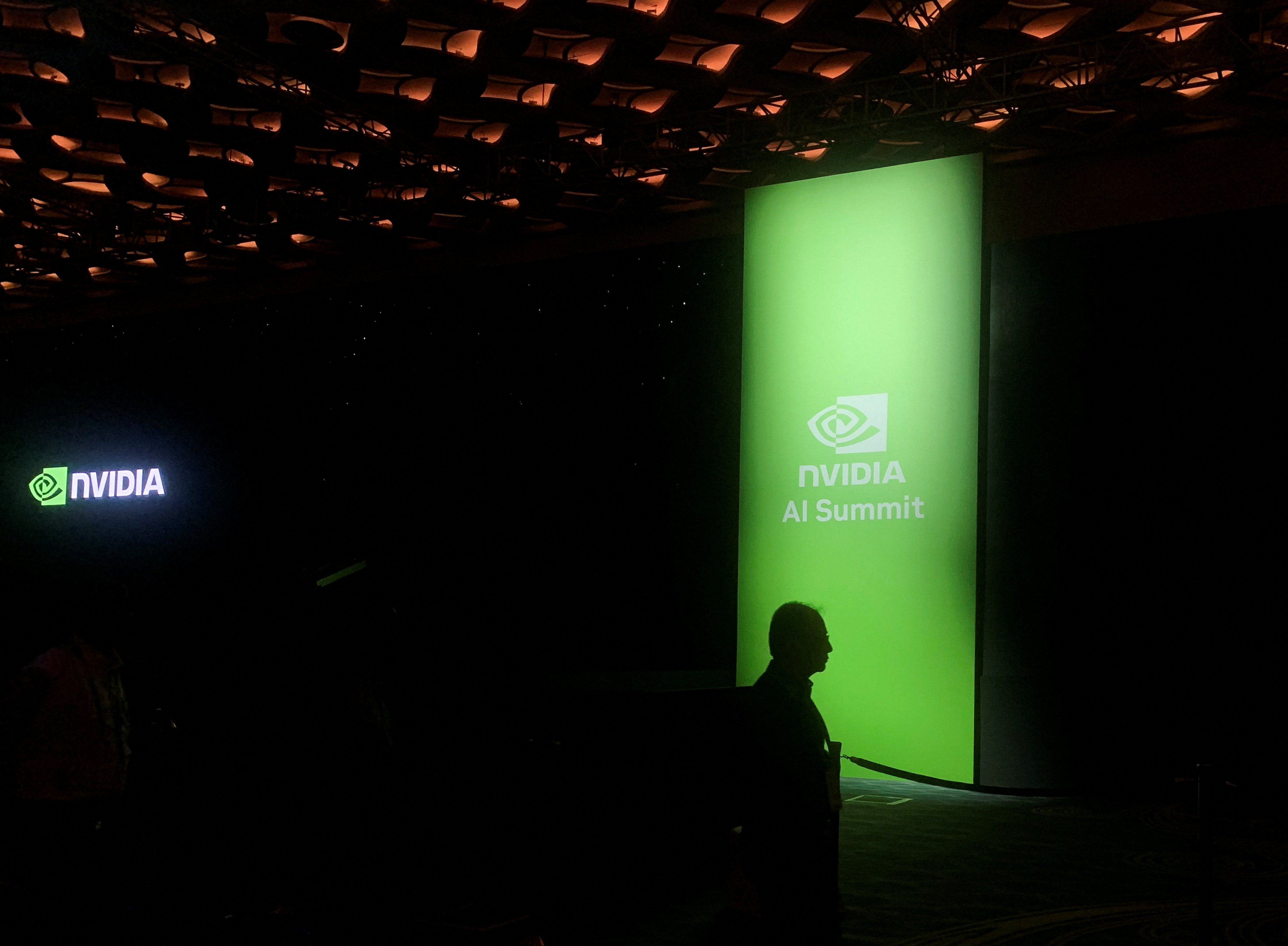 A man walks past the Nvidia logo at the company’s AI Summit in Mumbai, India, October 24, 2024. Photo: Reuters