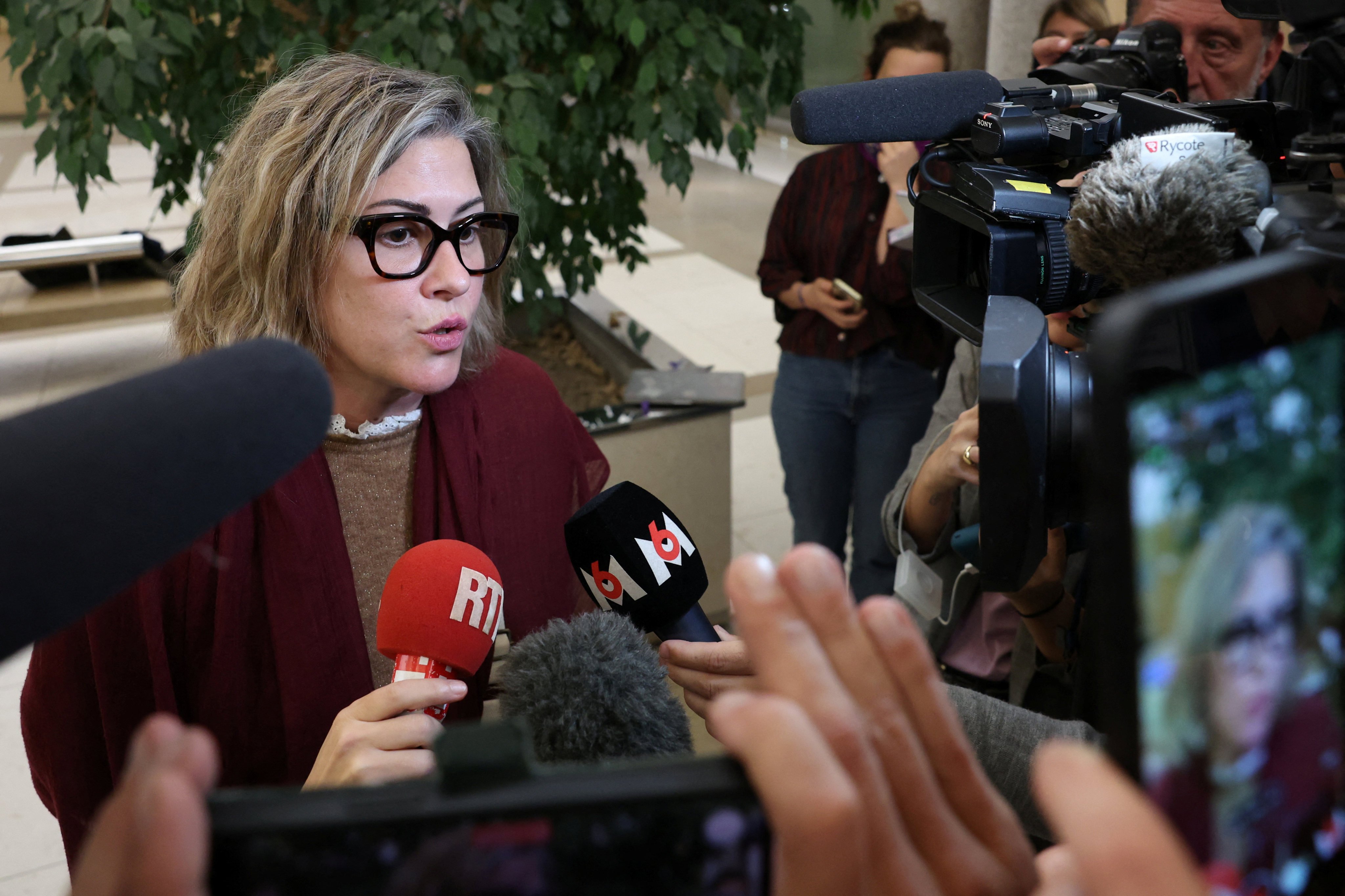 Caroline Darian, the daughter of Gisele Pelicot, talks to journalists during a break in the rape trial of her father Dominique Pelicot with 50 co-accused, at the courthouse in Avignon, France on Monday. Photo: Reuters