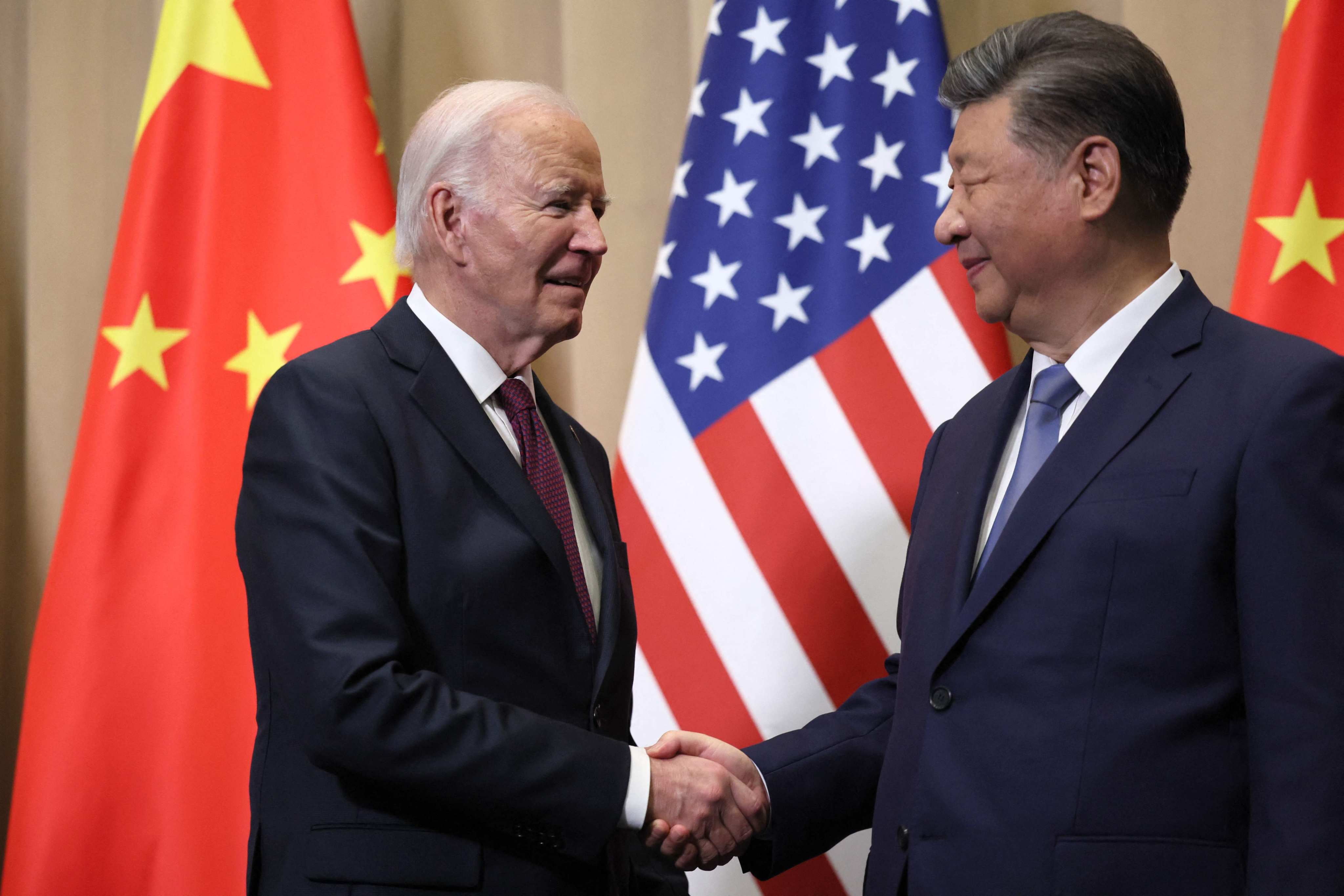 US President Joe Biden (left) shakes hands with Chinese President Xi Jinping on the sidelines of the Asia-Pacific Economic Cooperation summit in Lima, Peru on Saturday. Photo: AFP