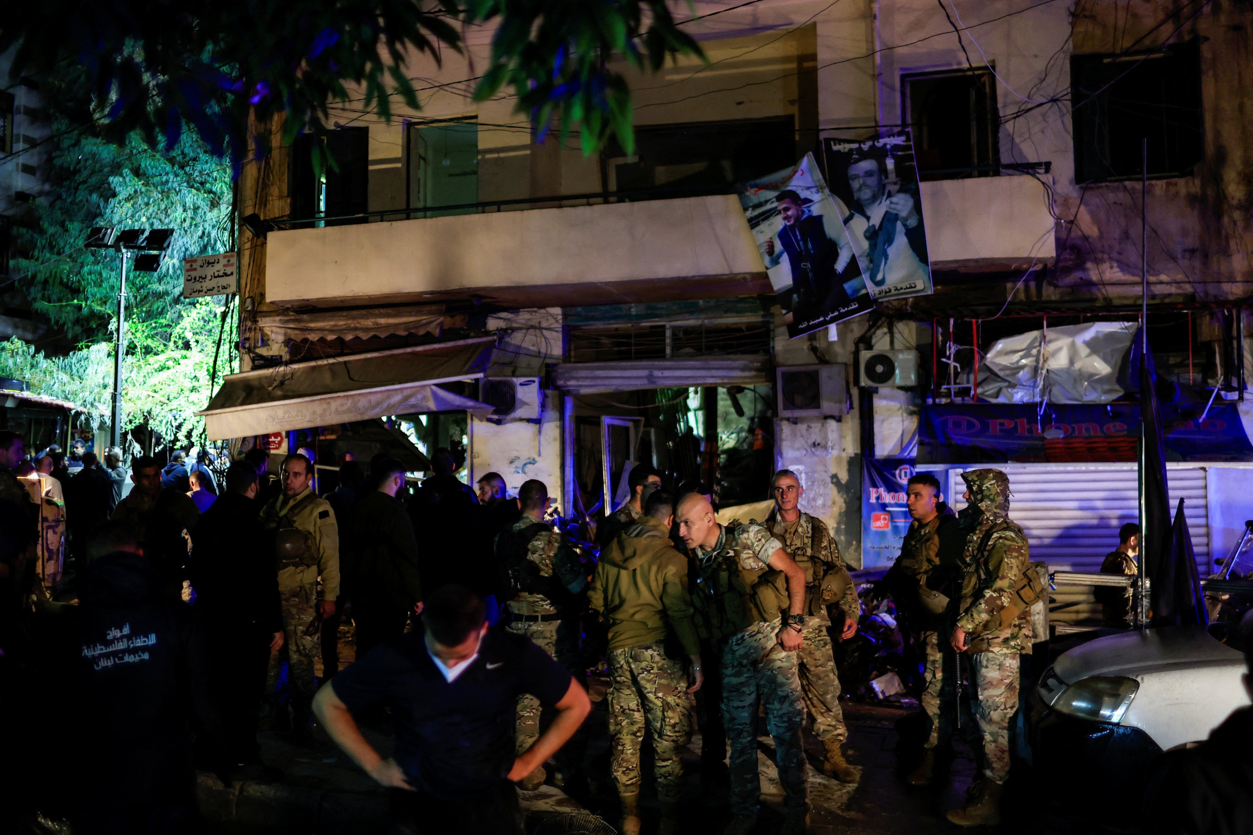 People gather in the aftermath of an Israeli strike in the Zoqaq al-Blat neighbourhood in Beirut. Photo: Reuters