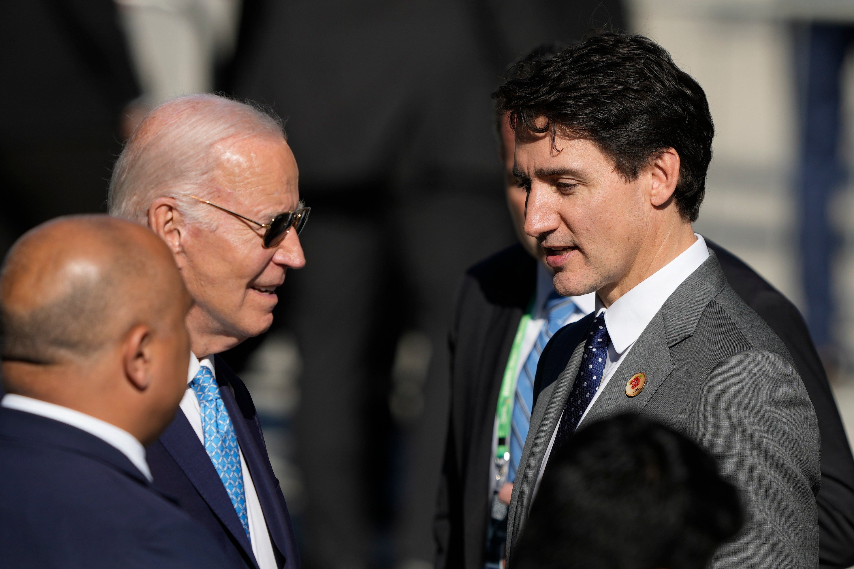 US President Joe Biden and Canada’s Prime Minister Justin Trudeau arrived late for the group photo. Photo: AP